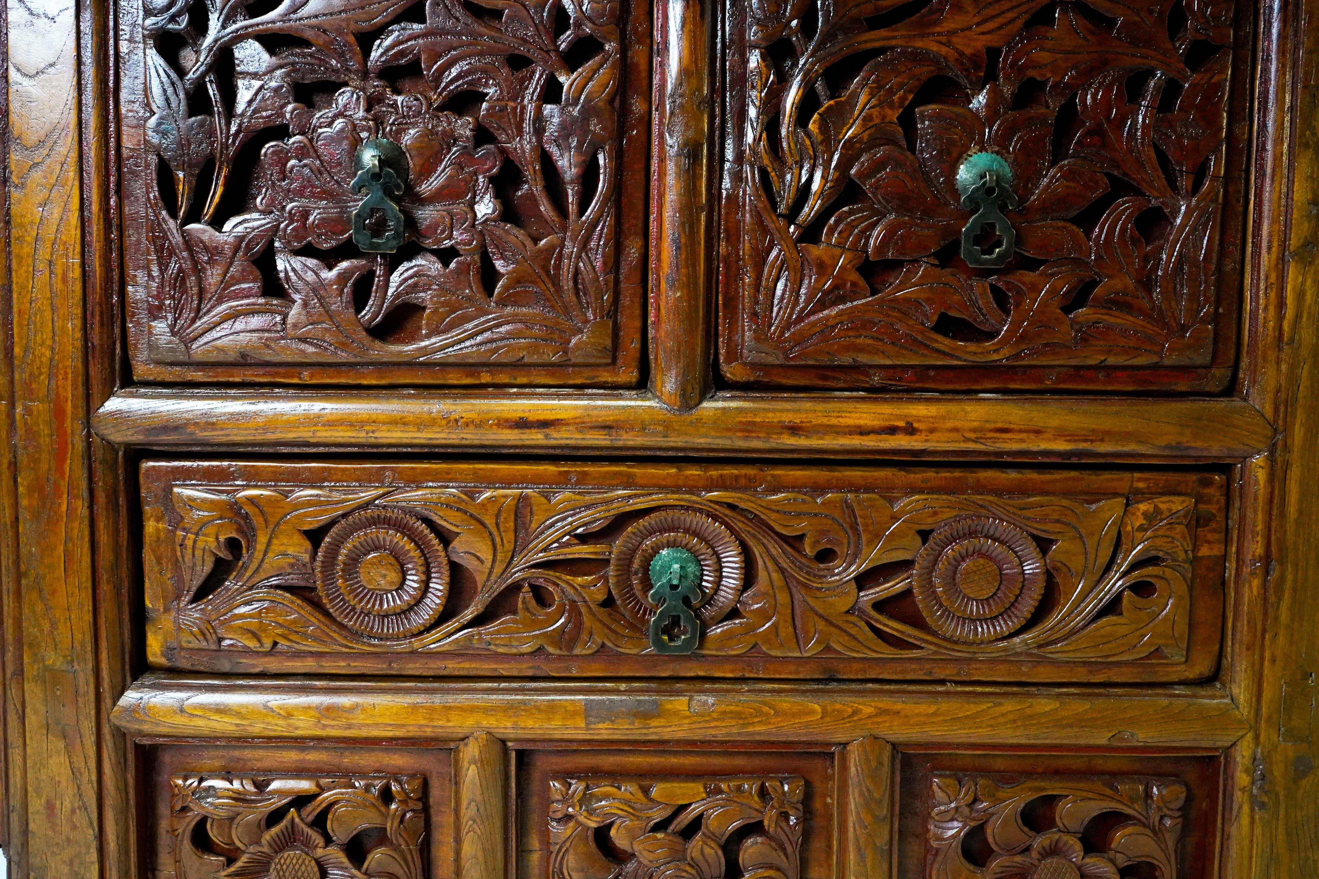 A Butterfly Style Storage Cabinet With Carved Spandrels For Sale 7