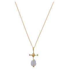 A Byzantine gold and chalcedony cross pendant circa 4th - 6th century AD