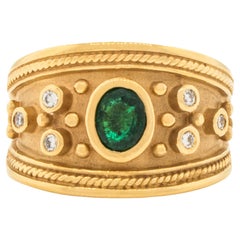 A Byzantine Ring with Oval Emerald and Diamonds made of 14K Yellow Gold