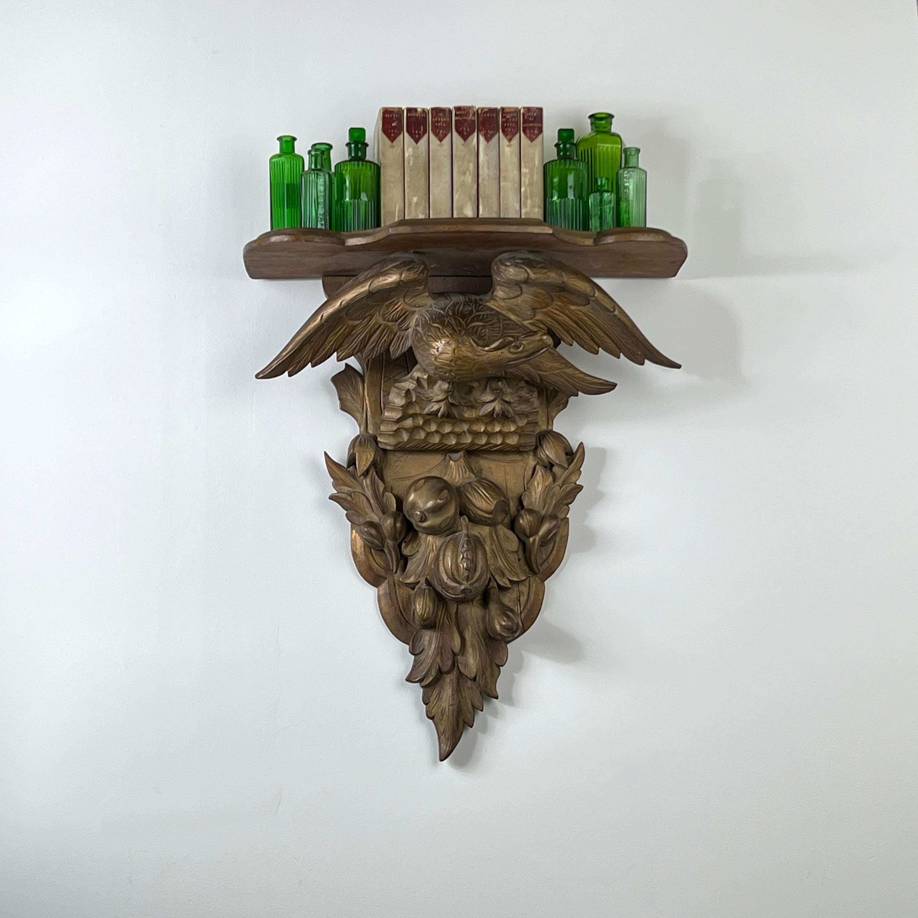 A 19th Century Carved Giltwood Wall Bracket

A beautifully decorative wall shelf with larger proportions. The elegantly contoured shelf is supported by the feathered wings of the eagle below.

The attractive, shaped backplate features intricate