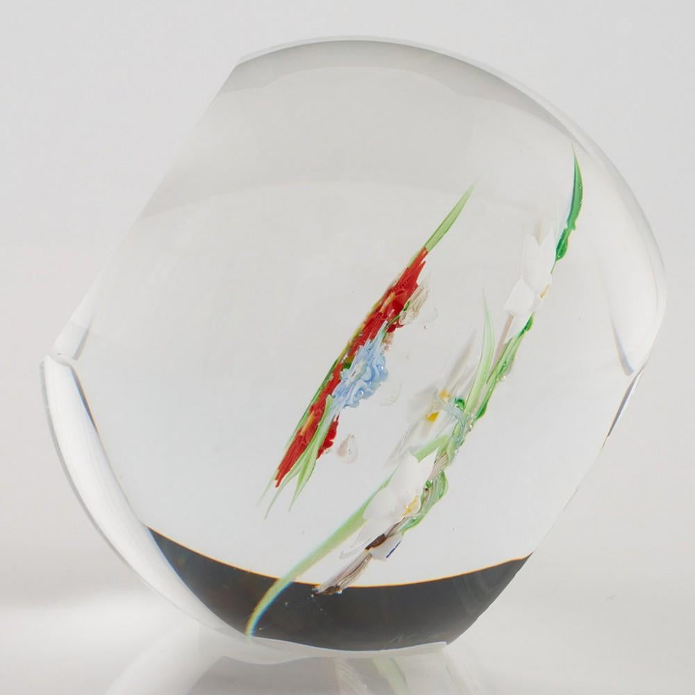 Heading : A Caithness Whitefriars Allan Scott Still Life Lampwork Paperweight 1988
Date : 1988
Origin : Scotland
Features : Garland of lampwork flowers and leaves within a pinched basket, facet cut window 
Marks : Whitefriars monk cane.....63/100