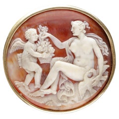 A Cameo Brooch Depicting Venus and Cupid