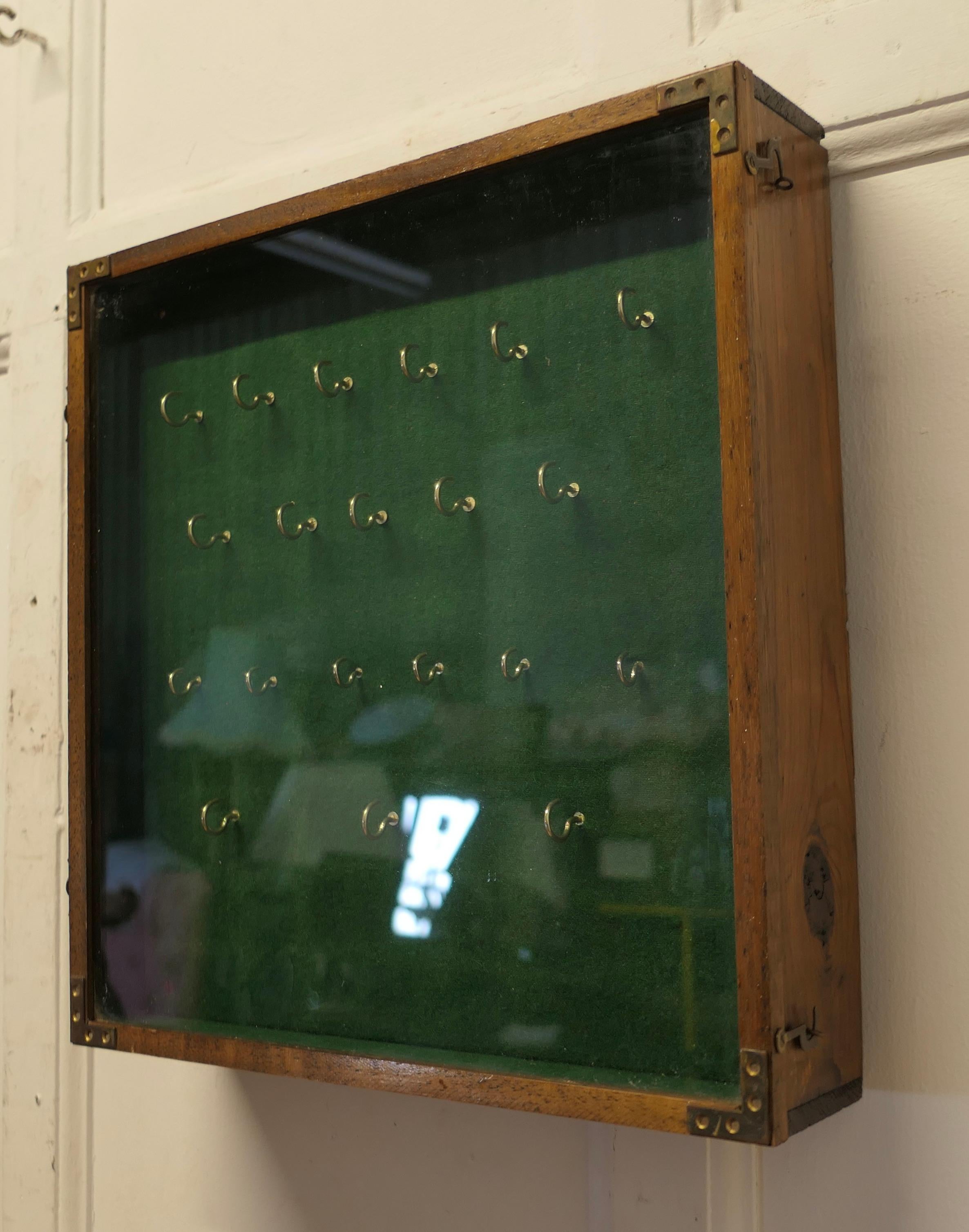 Mid-20th Century A Campaign Style 20 Hook Wall Hanging Key Cupboard   A glass fronted key cupboar