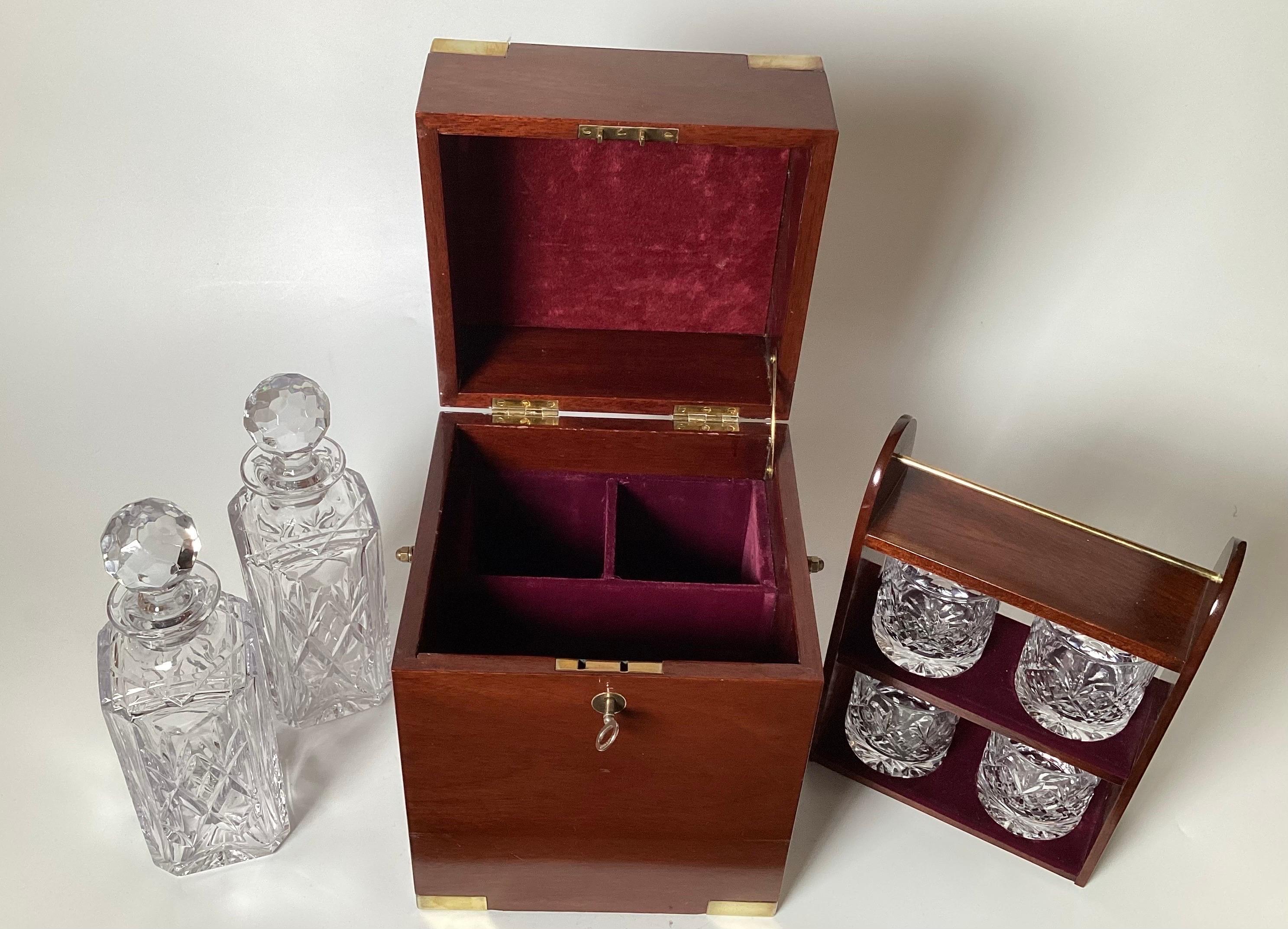 A Campaign Style Mahogany Tantalus With Crystal Decanters and Glasses.  8
