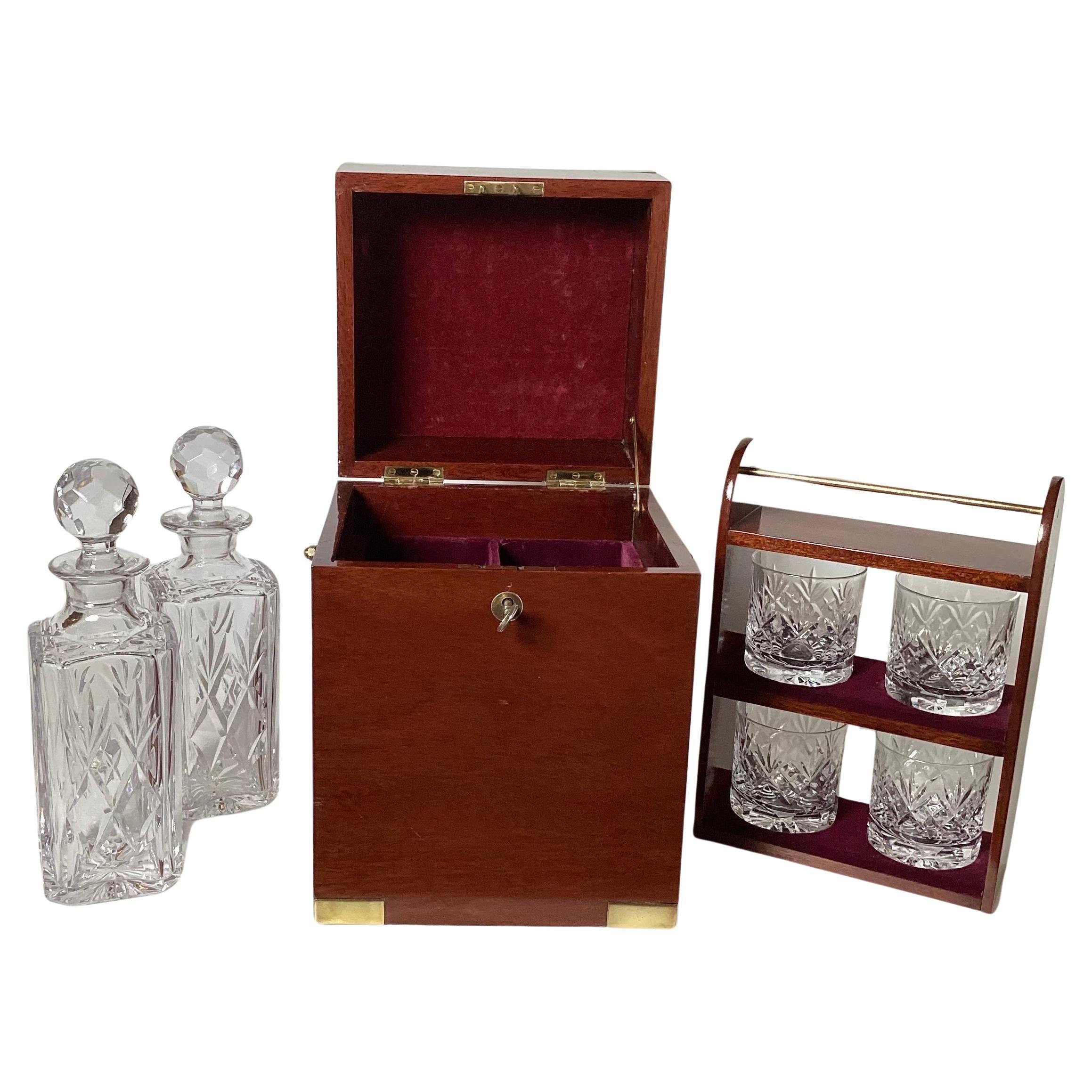 A Campaign Style Mahogany Tantalus With Crystal Decanters and Glasses. 