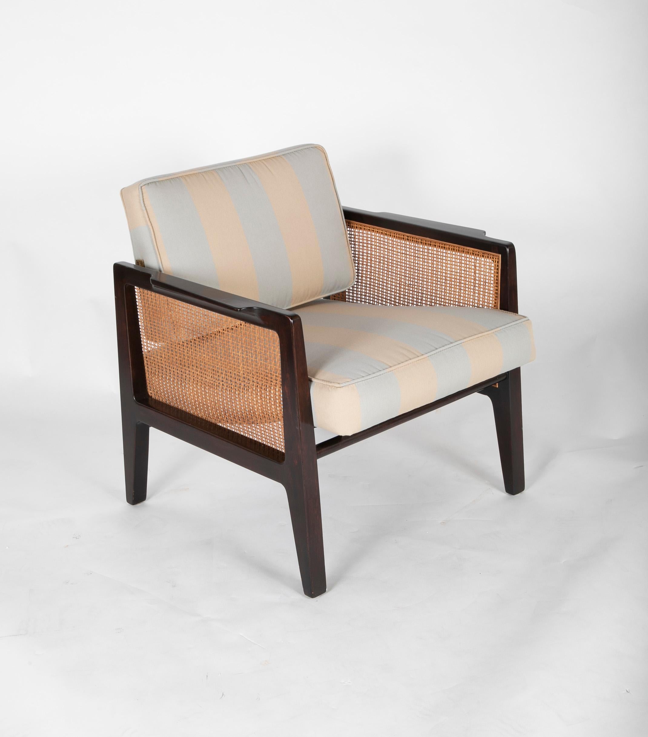 A sharp looking ebonized chair with caned side panels designed by Edward Wormley for Dunbar.
