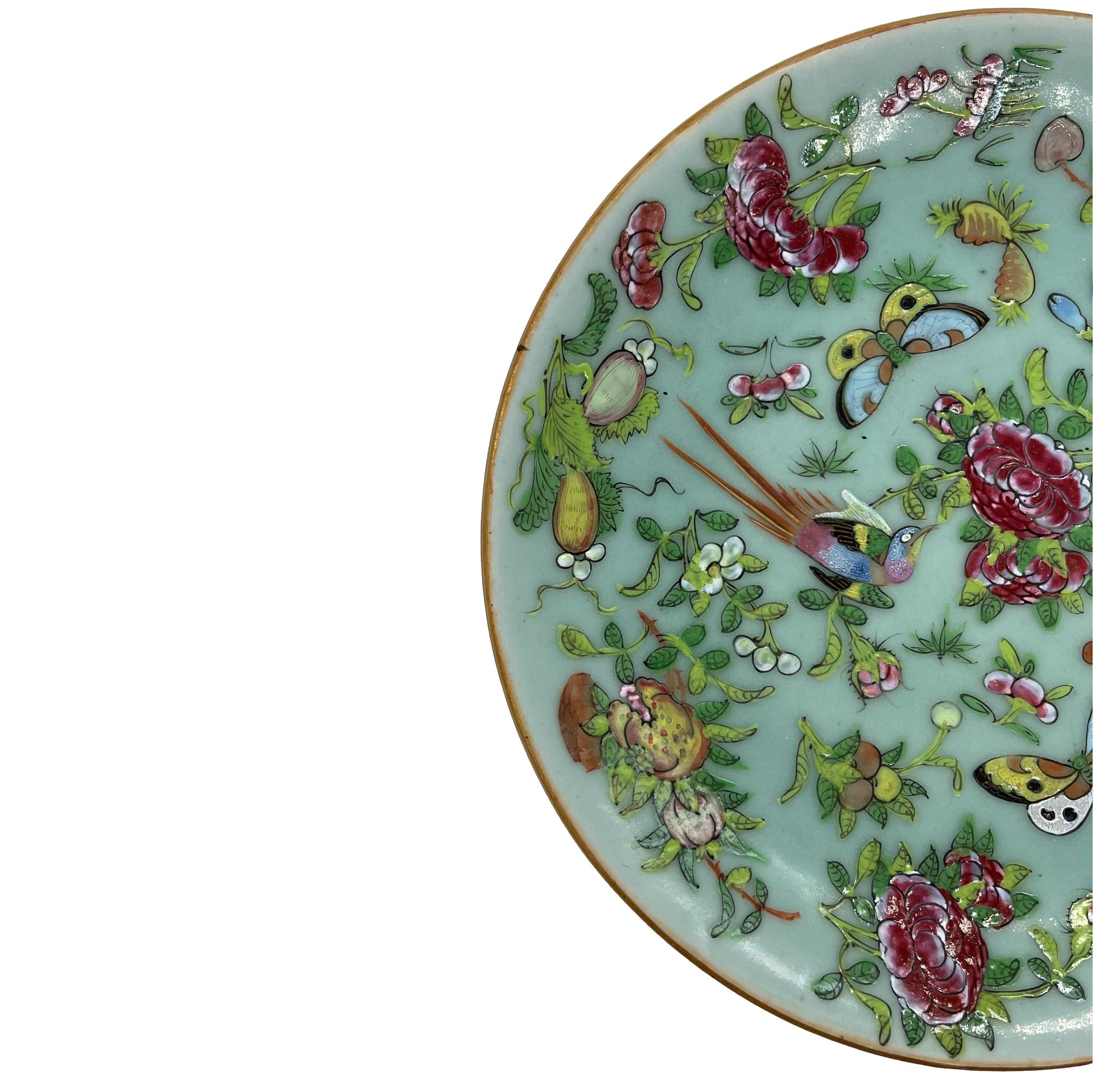 A Canton Famille Rose Chinese Export Porcelain 9-inch Plate, the polychrome enameled surface with a colorful pheasant and butterflies, among fruit and floral sprays on a celadon blank, the reverse with blue painted Xianfeng (Hsien-Feng) seal, ca.