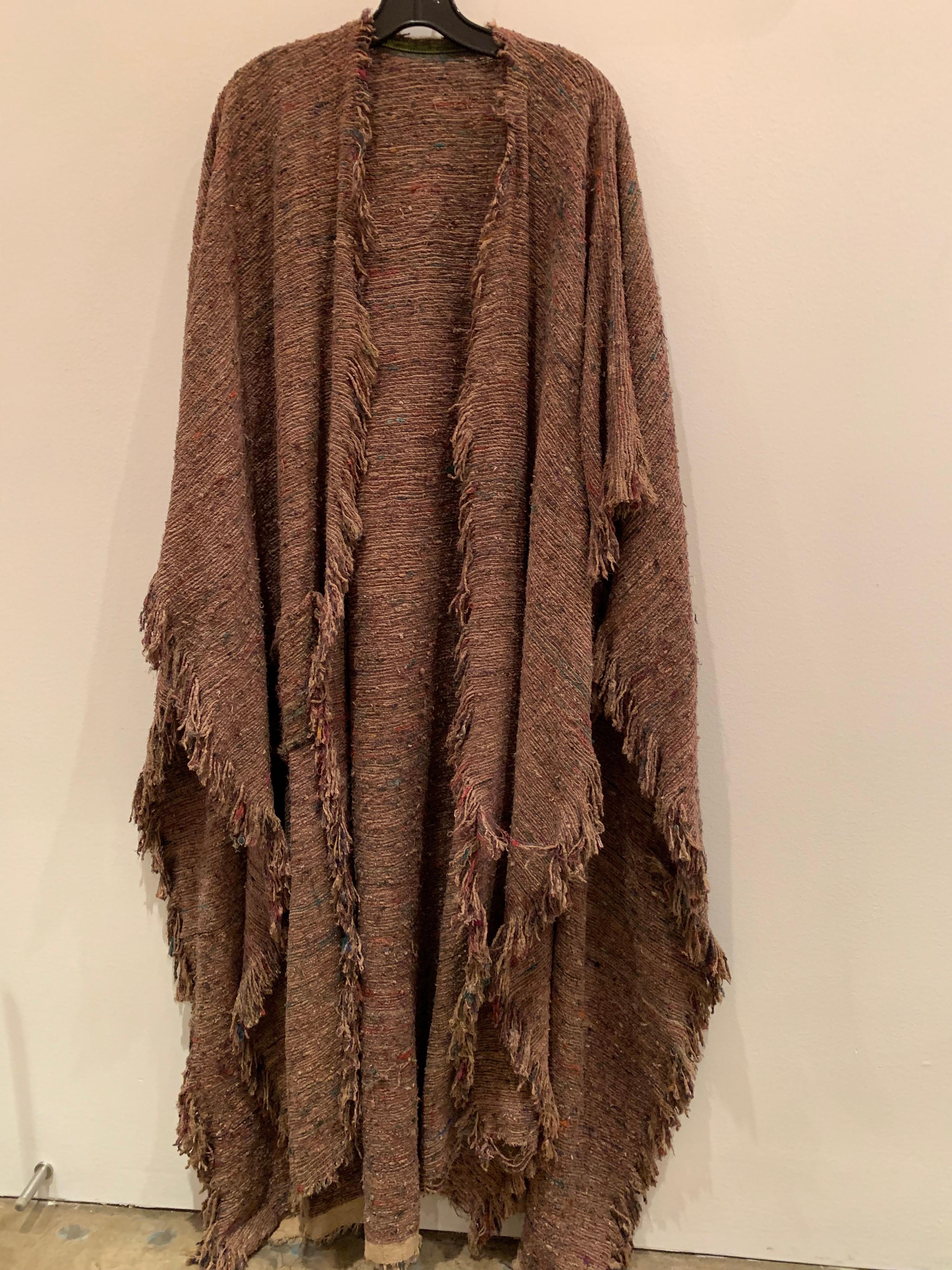 A beautiful, bohemian, cappuchino color hand-woven and over-dyed silk slubbed shawl or large wrap with fringed edges and various colors of fibers shot through the weave.  Earthy and gorgeous. 