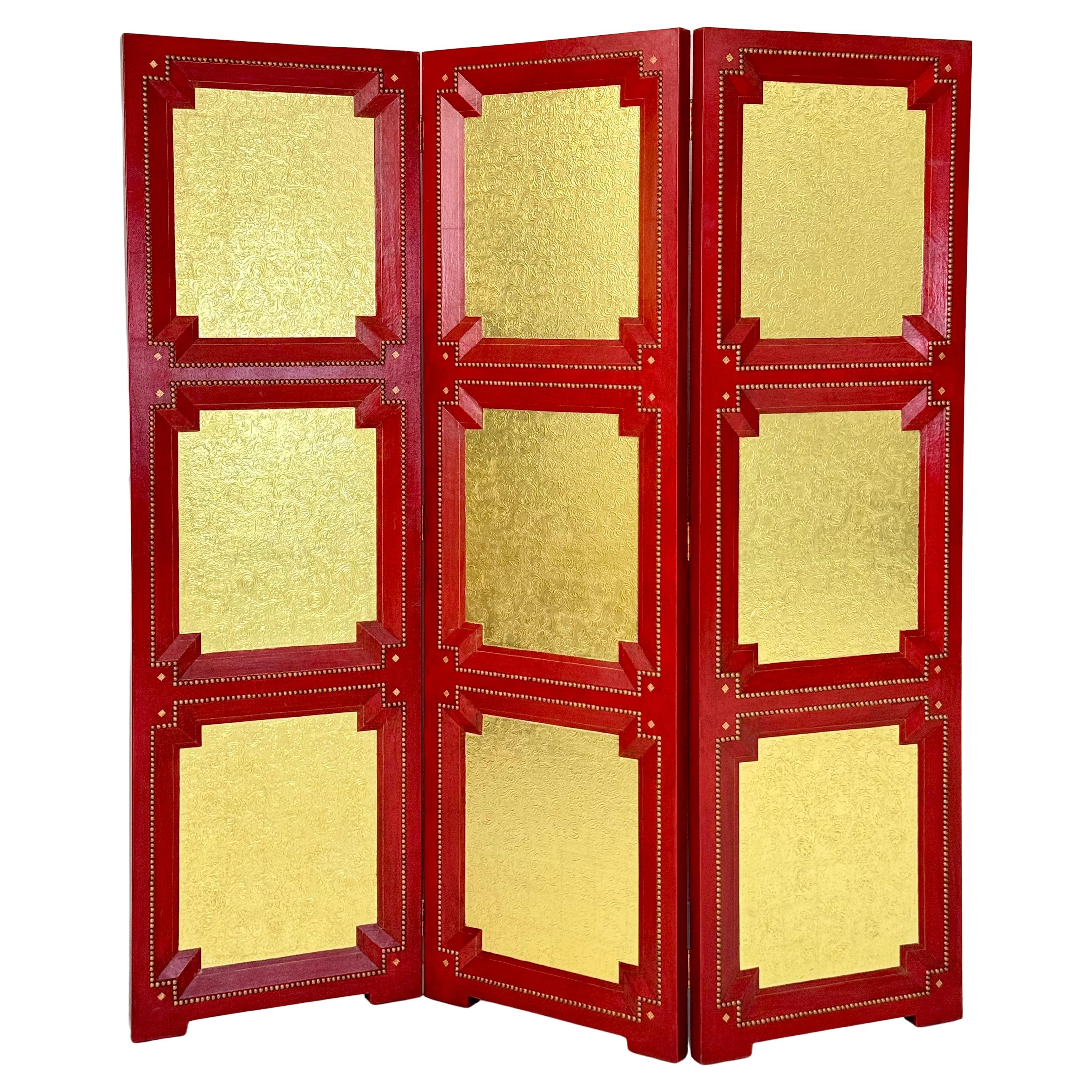 A Cardinal Red and Gilt Leather Three Panel Screen after Billy Haines For Sale