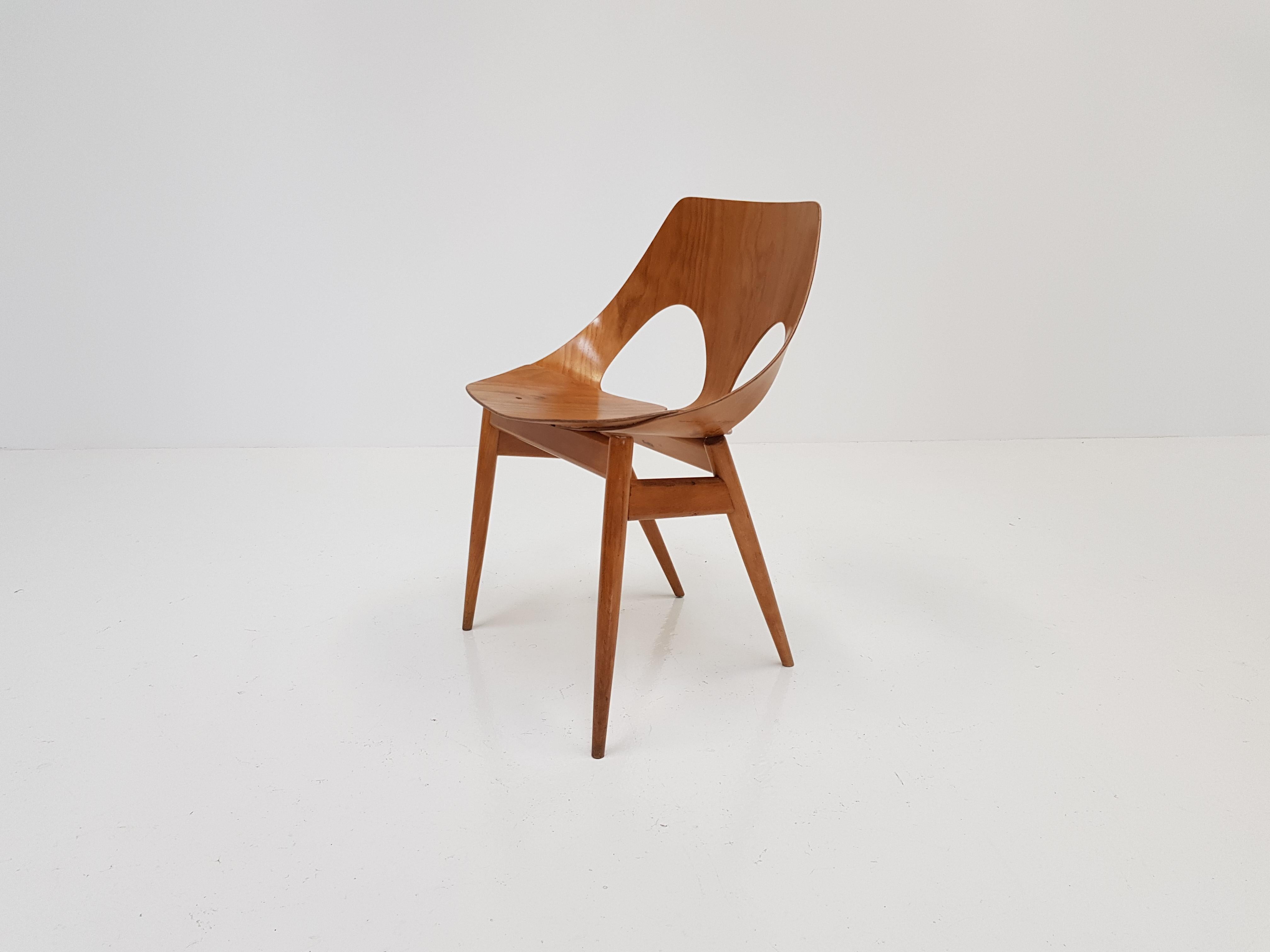 A 'Jason' chair, these iconic chairs were designed in the 1950s by Danish designer Carl Jacobs & Frank Guille and manufactured by Kandya.

The seat and back of the chair are folded from a single sheet of flexible plywood that wraps around the