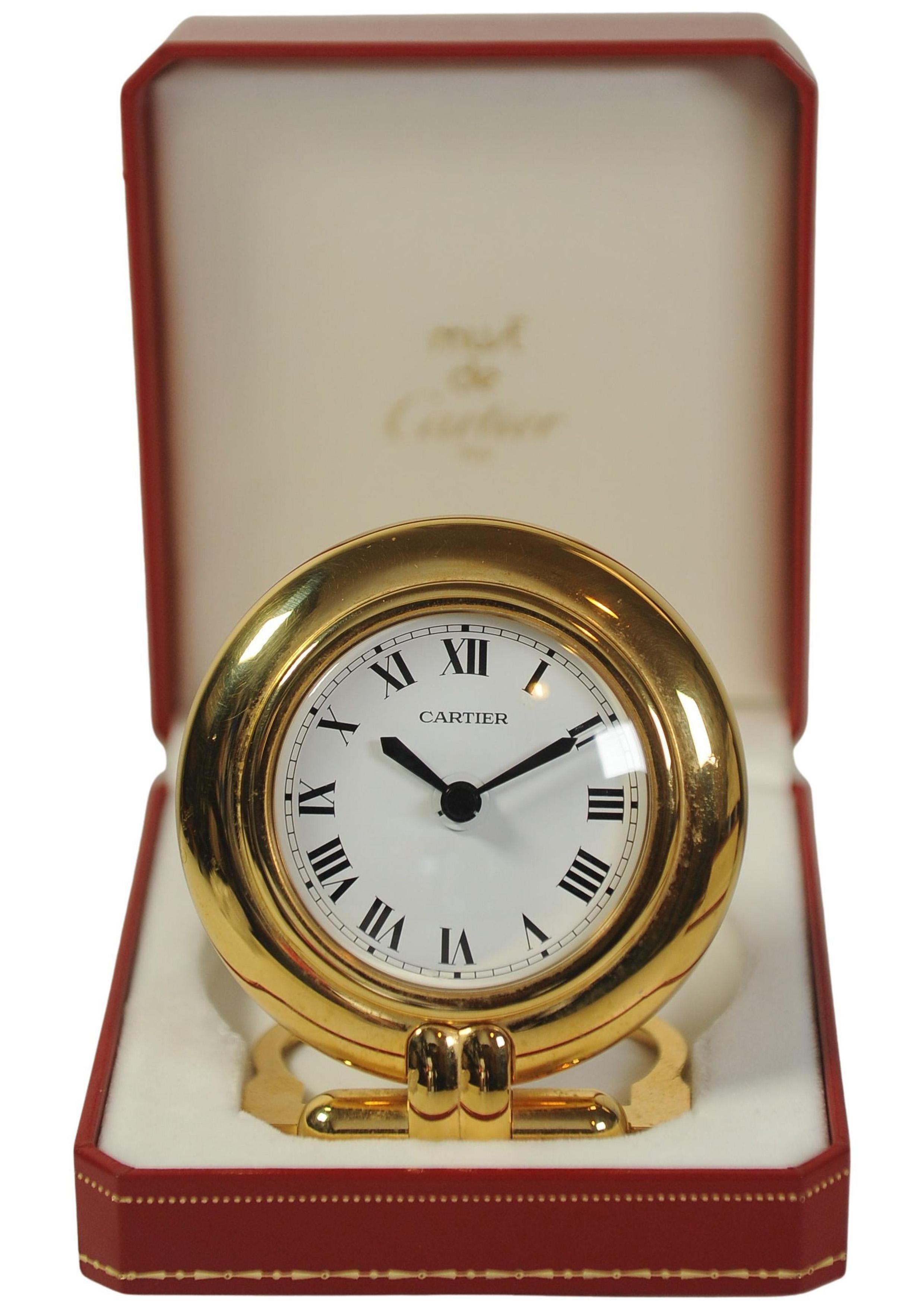 French A Cartier Gold Circular Travel Clock With Cartier Red Box