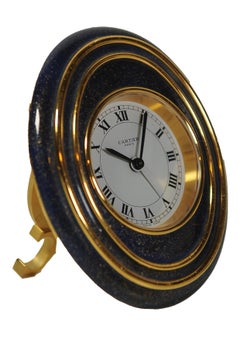 A Cartier Oval Gold Enamel 8-Day Mechanical Movement Alarm Desk Clock