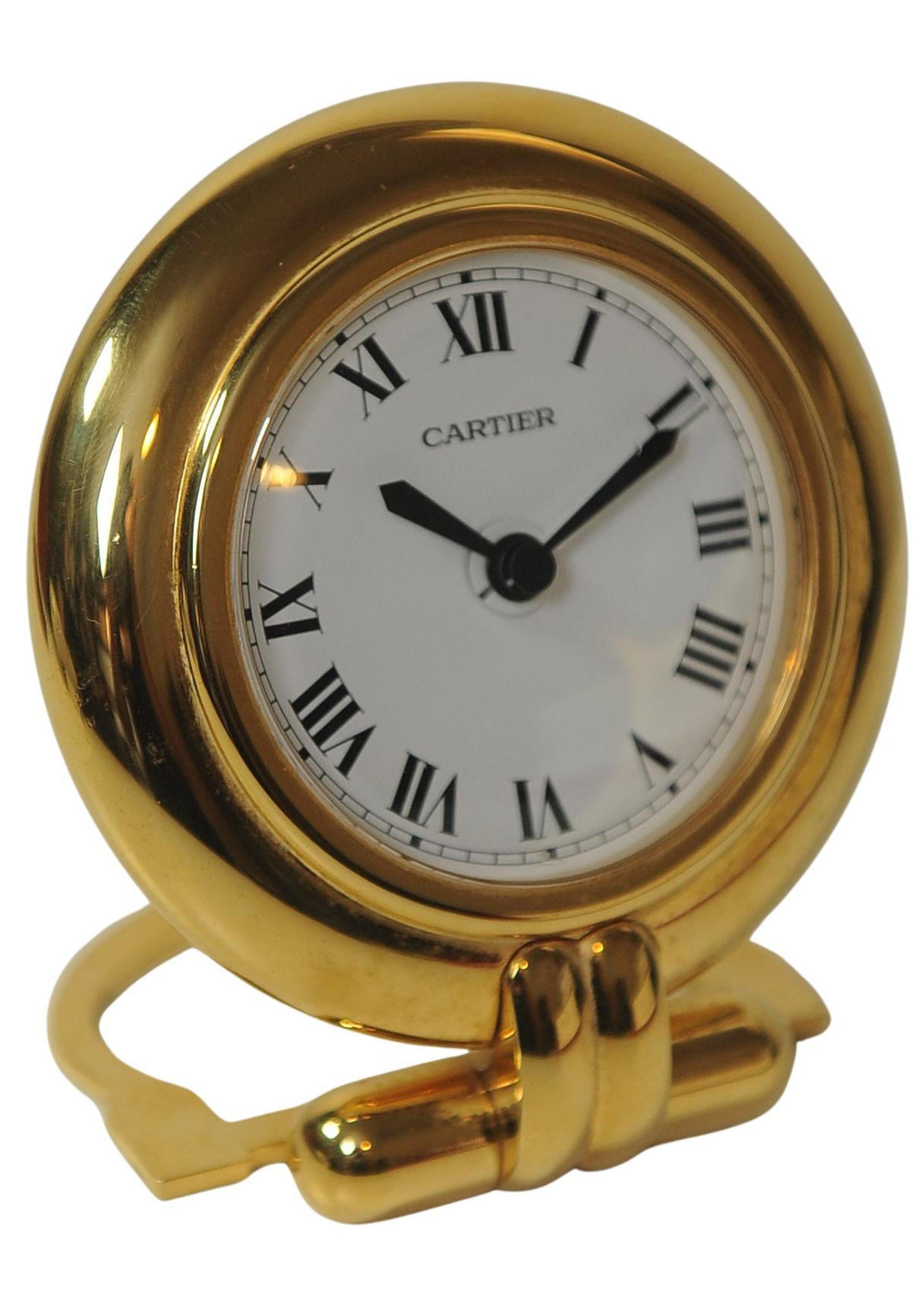 A Cartier Gold Circular Travel Clock With Cartier Red Box 1
