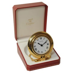 Orologio da viaggio circolare in oro di Cartier con scatola rossa di Cartier