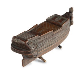 A carved boxwood prisoner of war battleship snuff box