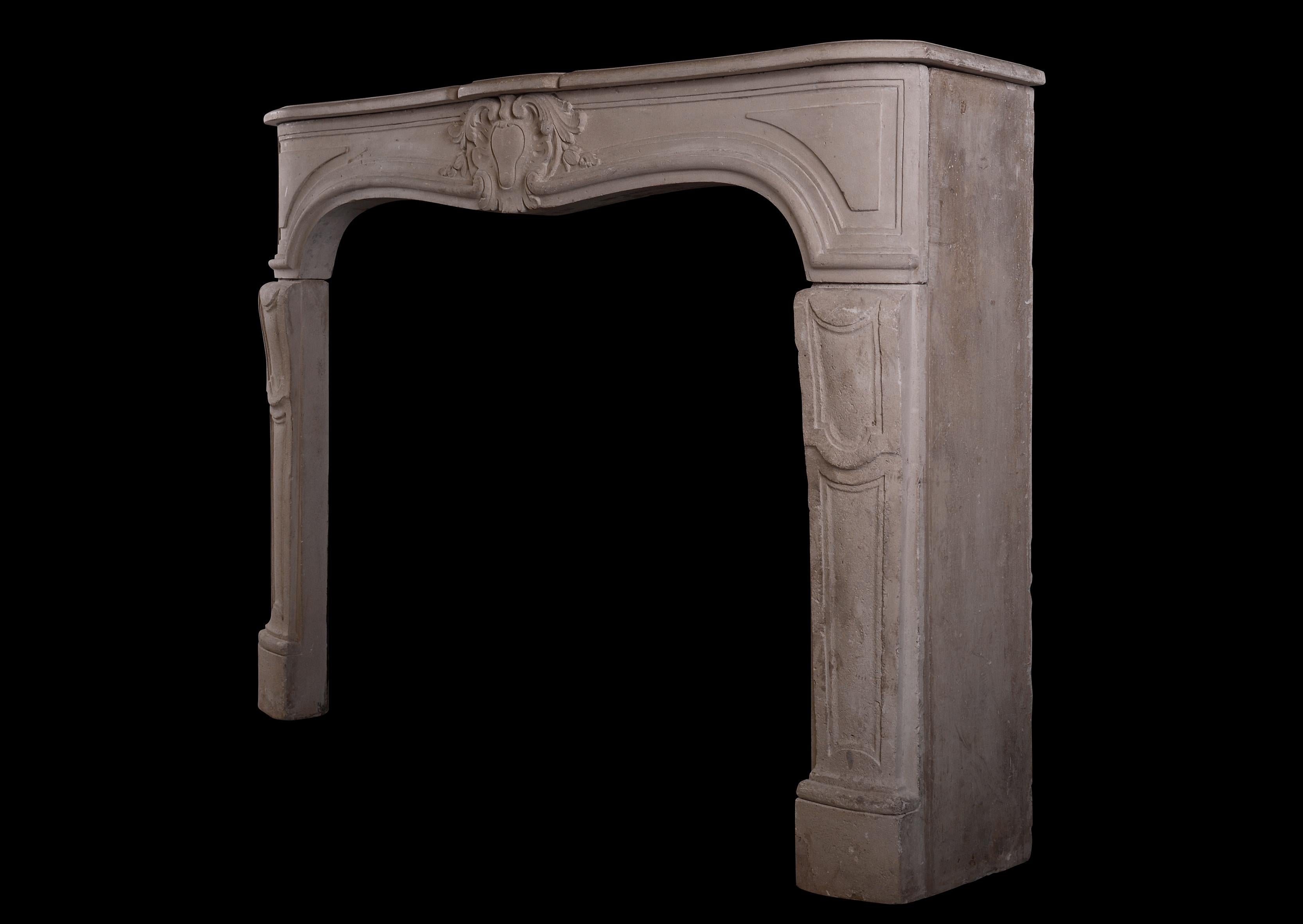 19th Century Carved French Limestone Fireplace in the Louis XV Manner For Sale
