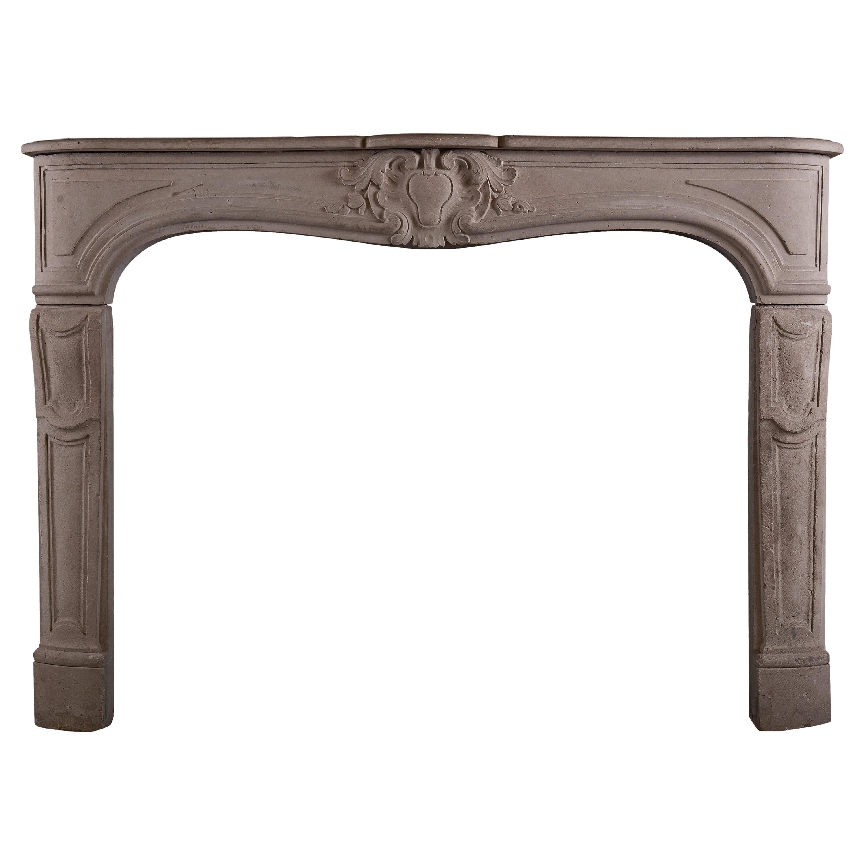 Carved French Limestone Fireplace in the Louis XV Manner For Sale