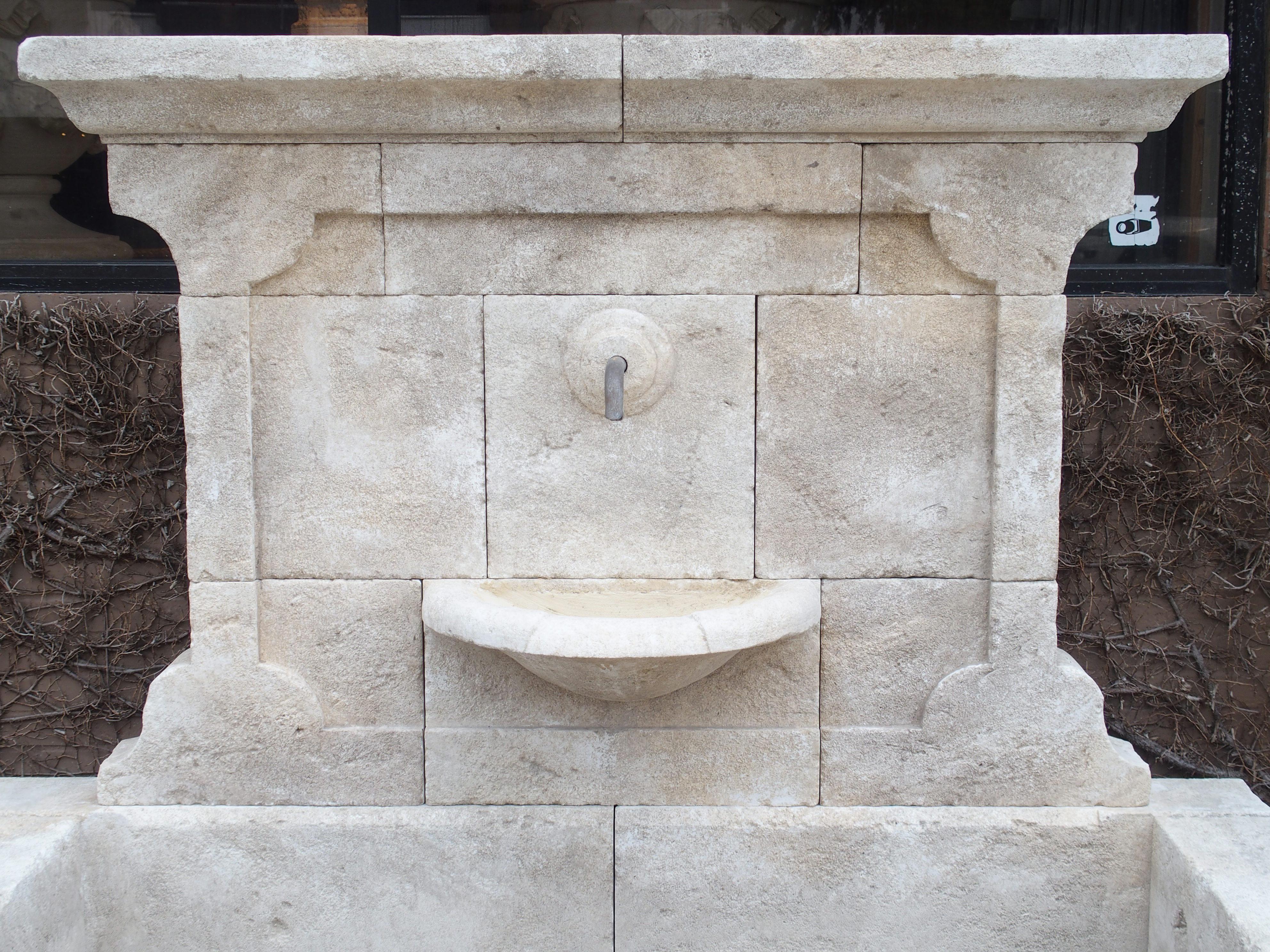 Hand-Carved Carved French Stone Wall Fountain with Cast Iron Spout and Spill Bowl