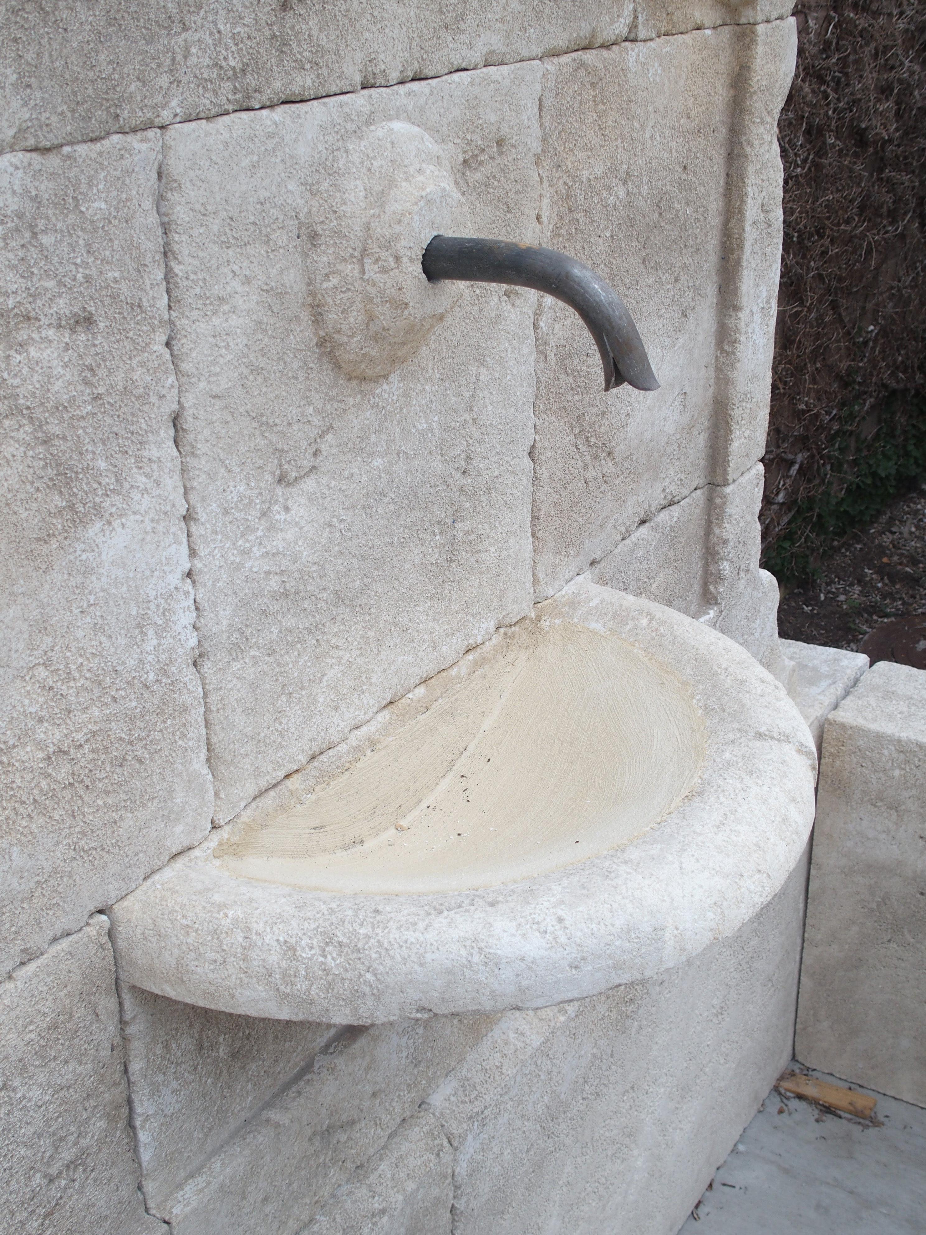 Contemporary Carved French Stone Wall Fountain with Cast Iron Spout and Spill Bowl