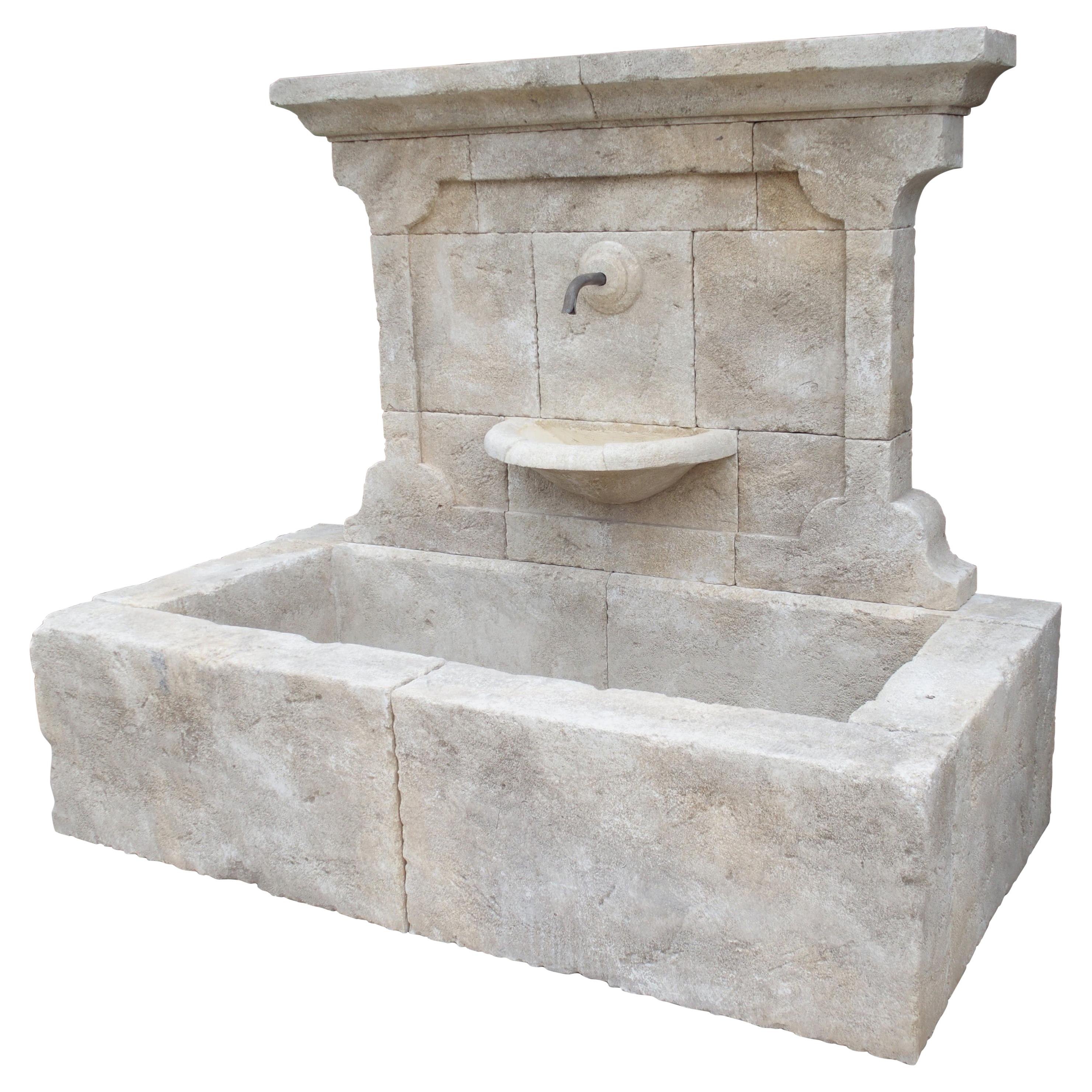 Carved French Stone Wall Fountain with Cast Iron Spout and Spill Bowl
