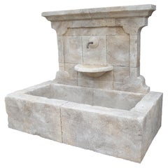 Carved French Stone Wall Fountain with Cast Iron Spout and Spill Bowl