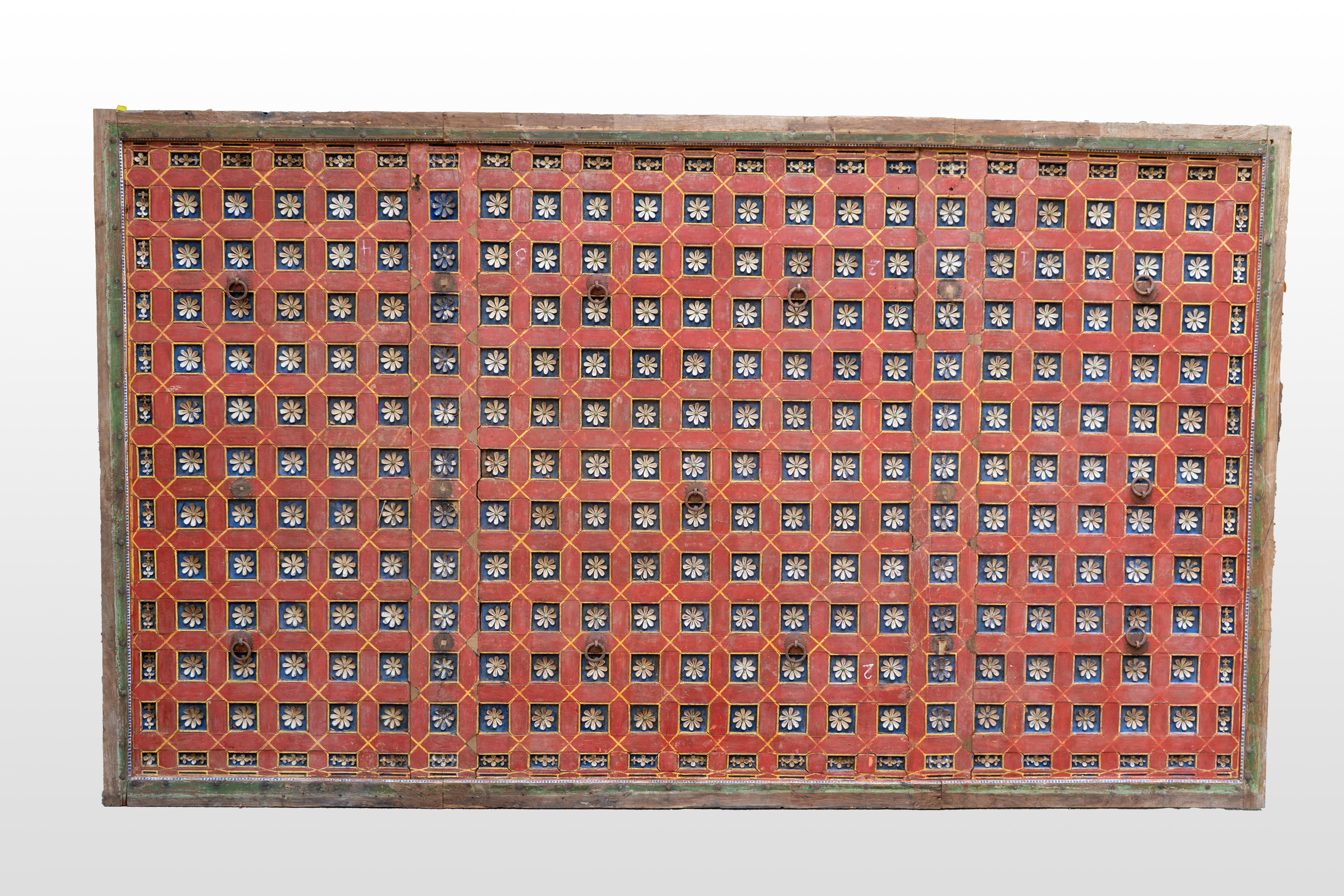 A rare 20th century Indian ceiling panel. This wooden panel came from an old haveli mansion in Gujarat. The design is a coffered grid with strong rectangular lines softened and enlivened with lotus flowers. All pieces interlock with