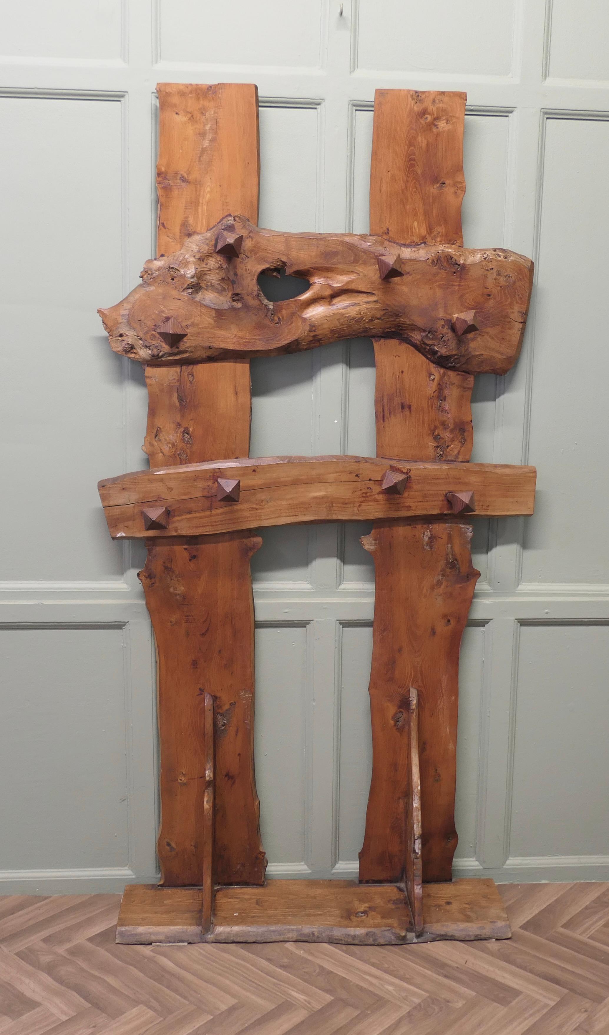 A Carved Live Edge Hall Coat Stand

A superb and unique piece for your Country Porch or Log Cabin, this one off unique piece has been hand made in elm, note the detail of the matching chunky coat hangers, it is very strong and sturdy, approximately