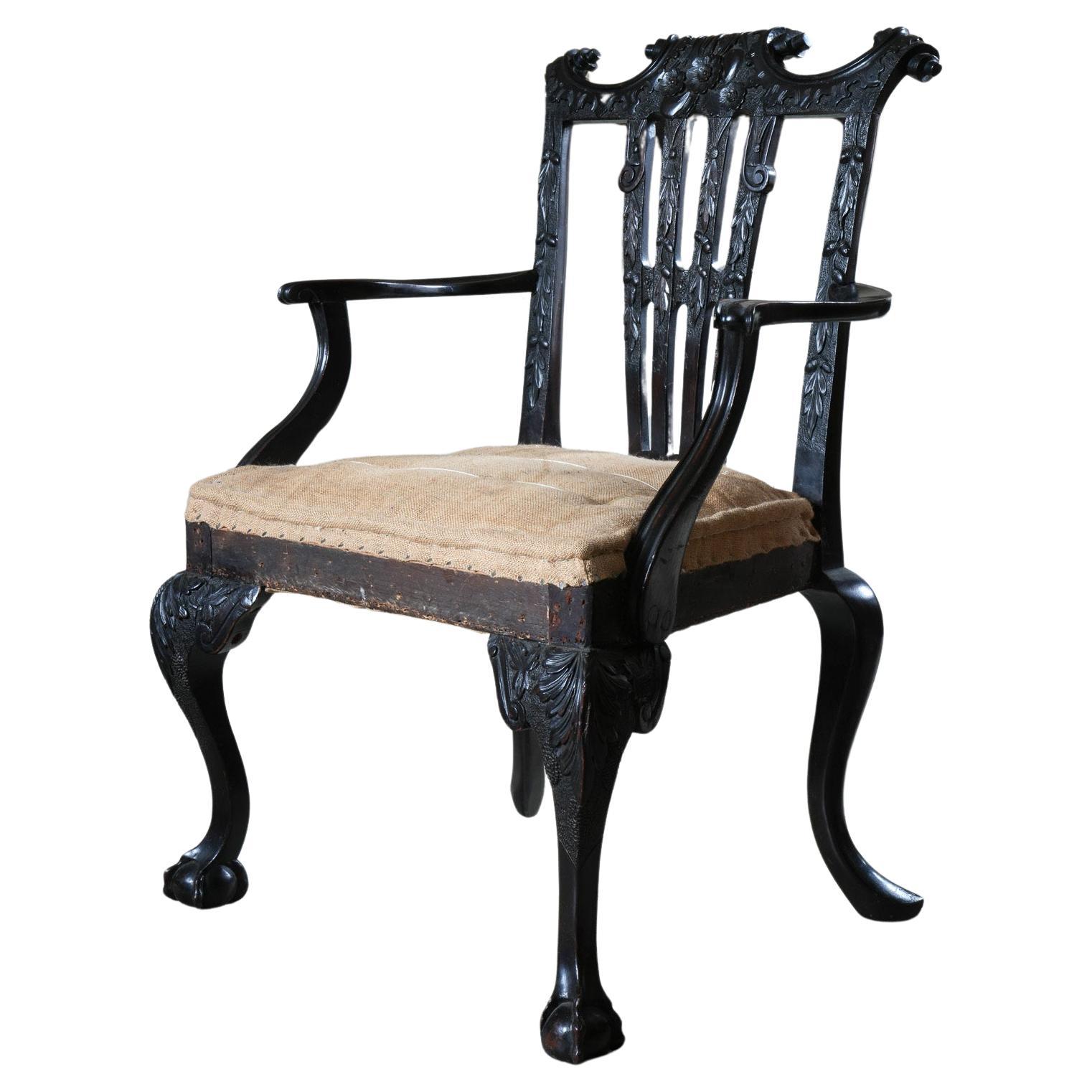 A Carved Mahogany George II Style Open Armchair