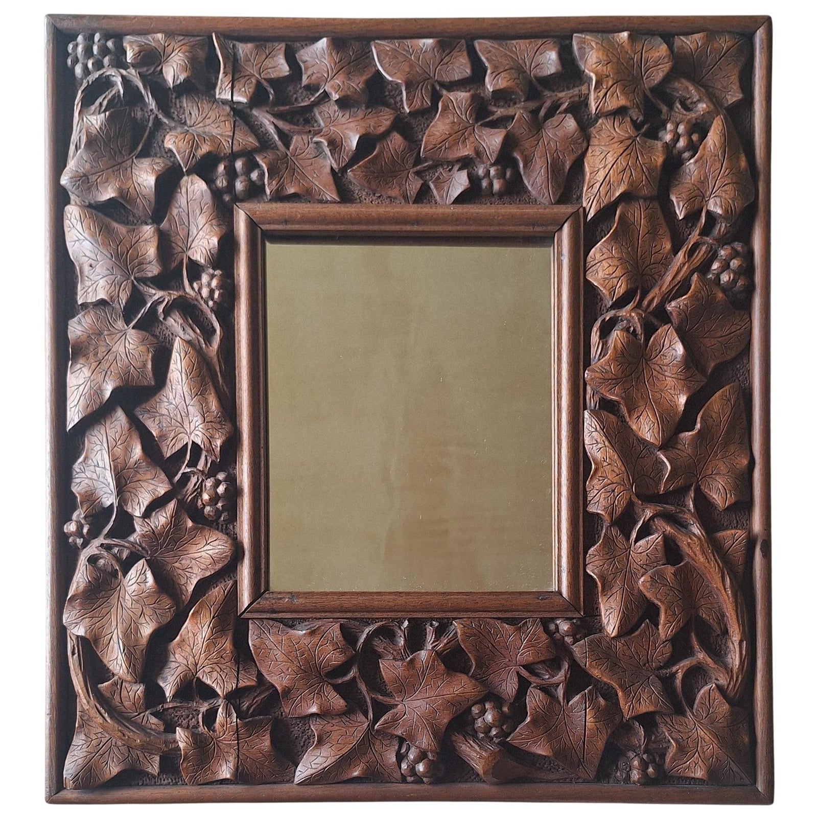 A Carved Mahogany Mirror, circa 1900 For Sale