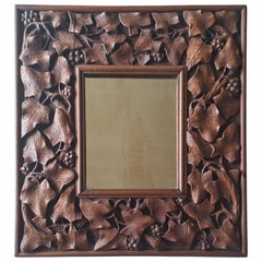 A Carved Mahogany Mirror, circa 1900