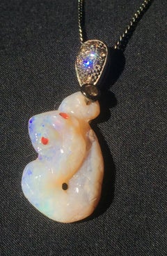 Opal Snake Pendant Set with Coniac Diamonds and Red Sapphires