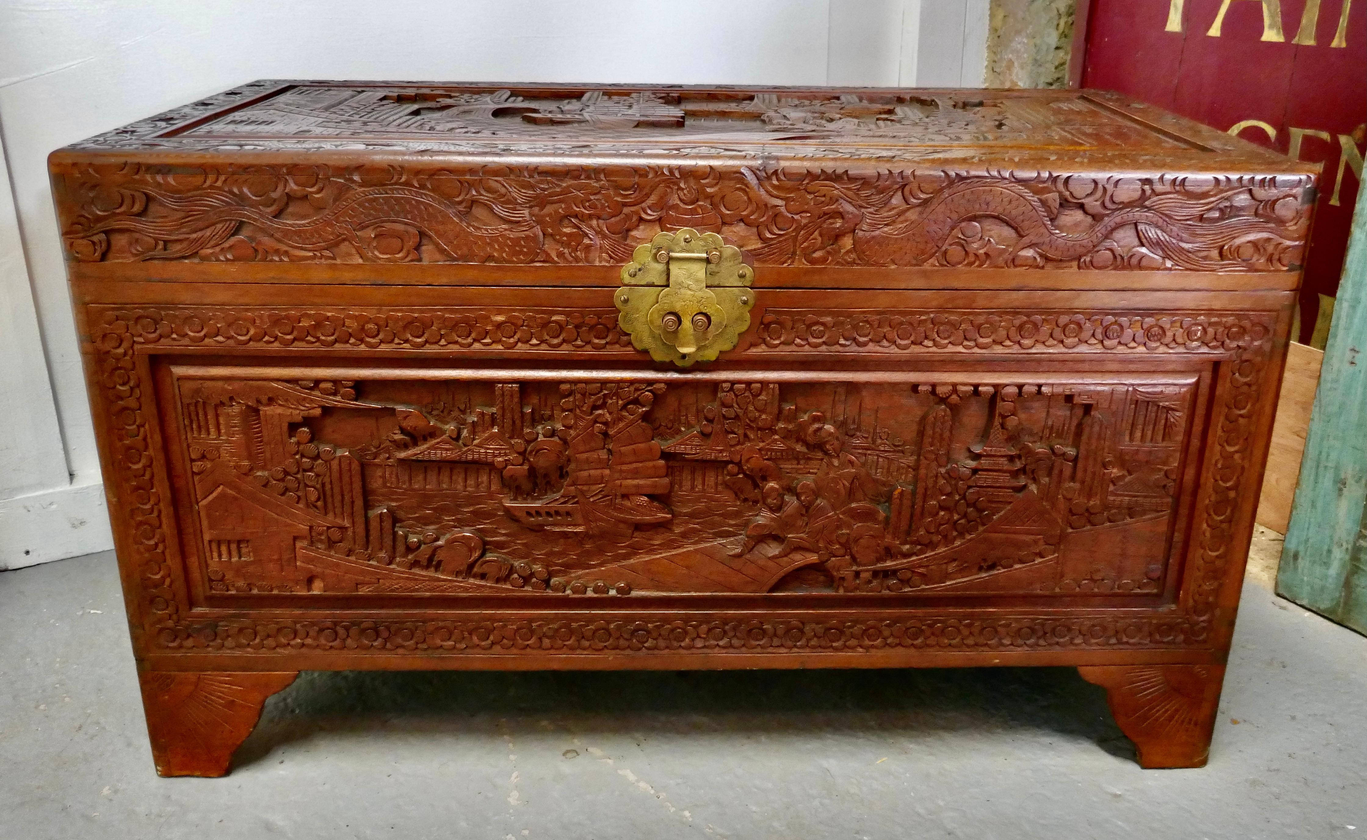 A carved oriental Camphor wood chest

This is a beautiful carved chest is made from Camphor wood, for those of you who do not know camphor wood it looks a lot like mahogany it is a hard wood which lends itself very well to carving.
However the