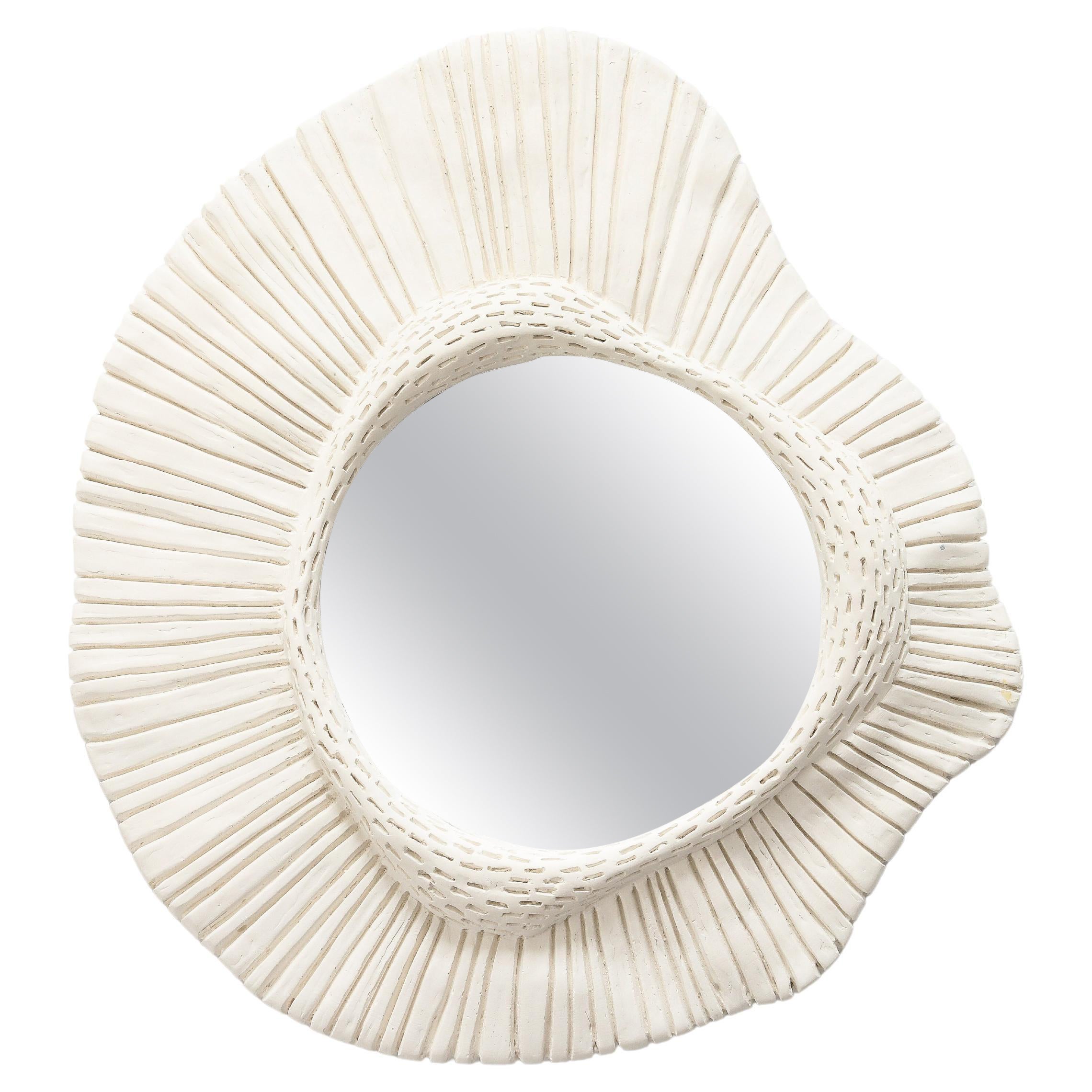 A Carved  Plaster Mirror