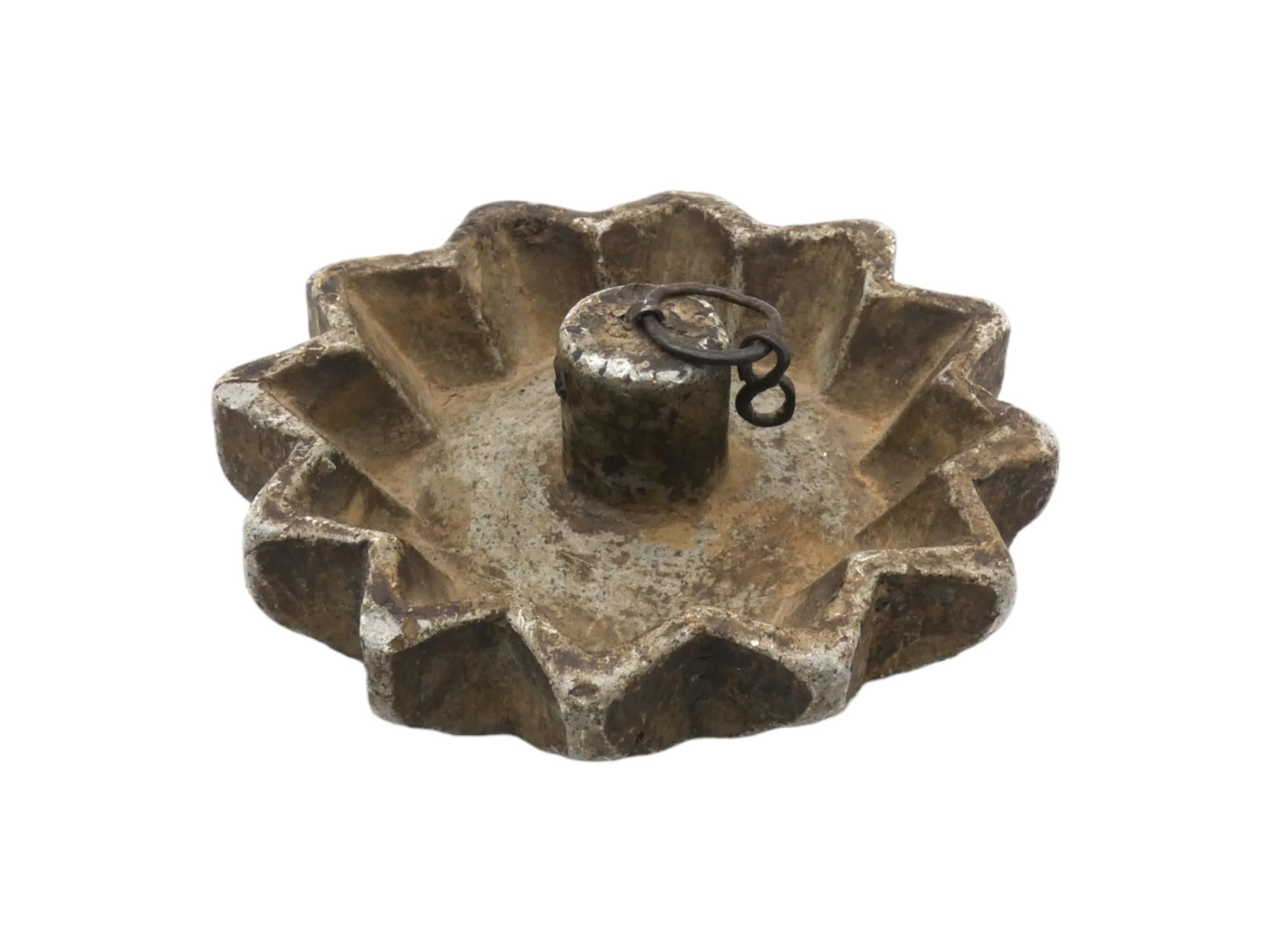 A Carved Stone Shabbat Lamp from Yemen circa 1900 is a prodigious artifact that reflects the artistic and religious traditions of Yemeni Jewish communities during that period. 

Yemen, historically home to a significant Jewish population, had a rich