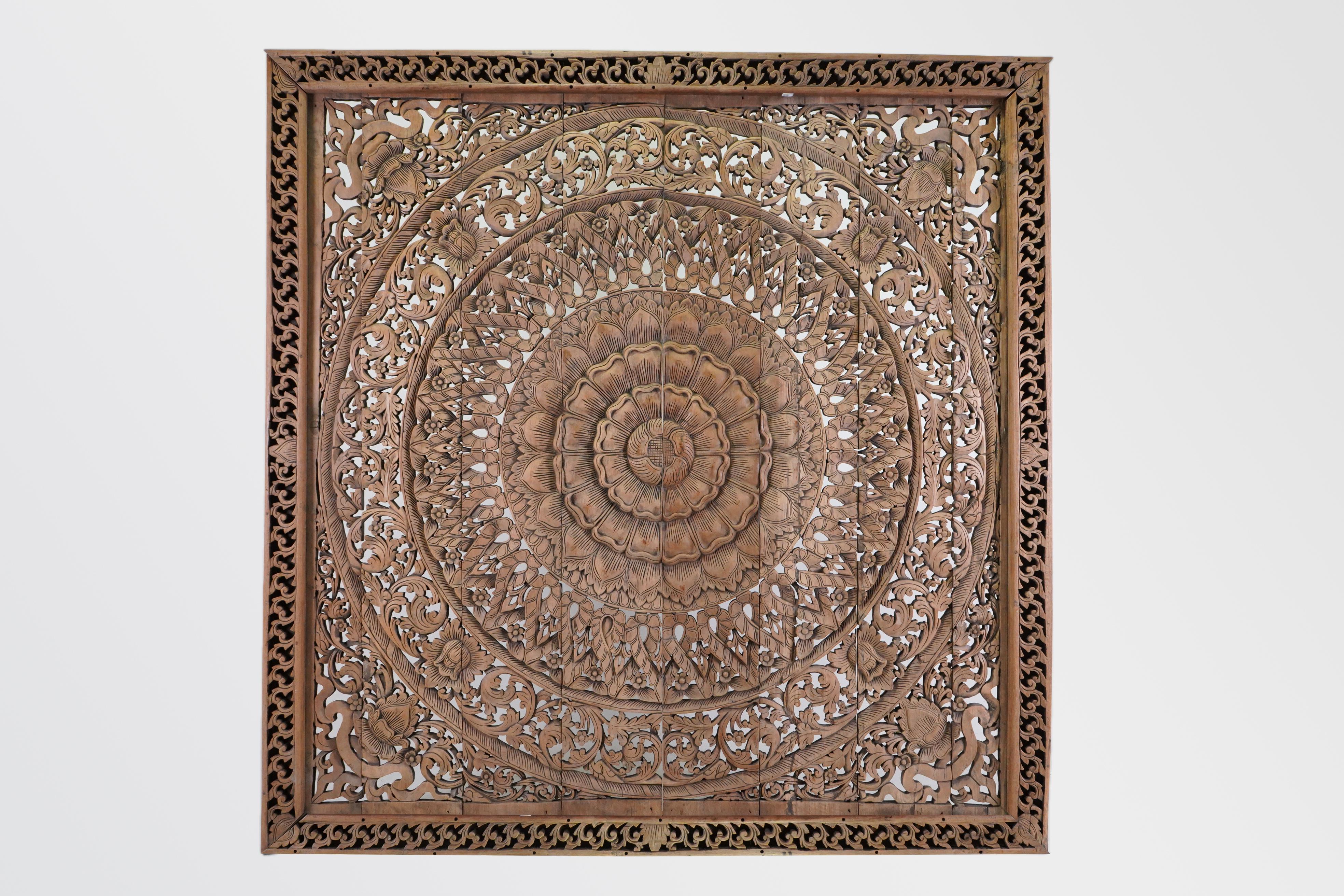Northern Thai temples often featured intricately carved wooden ceilings made up of coffered panels. The panels themselves were square with a circular design in the center. The overall effect is of a series of ornate wheels or cogs within a square