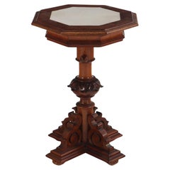 A carved walnut adjustable pedestal table, 19th C.