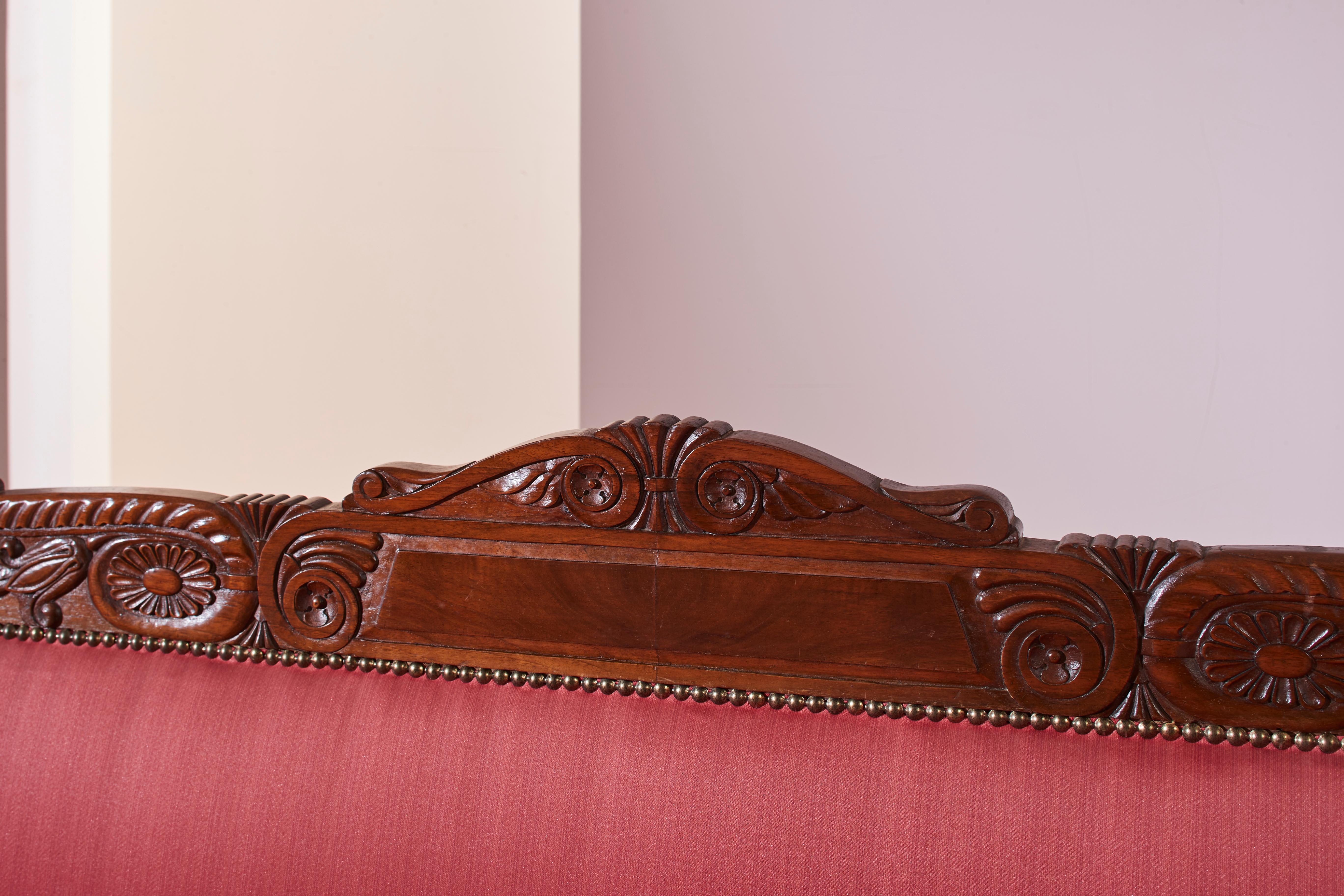 Fabric A carved walnut sofa with boat-shaped form in the style of Henry Thomas Peters For Sale