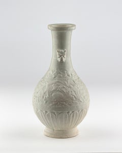 A Carved White Ware 'peony' vase, Song-Yuan dynasty