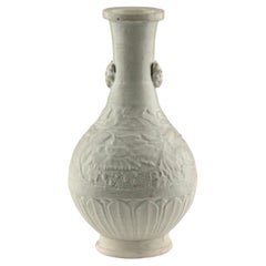 A Carved White Ware 
peony
 vase, Song-Yuan dynasty