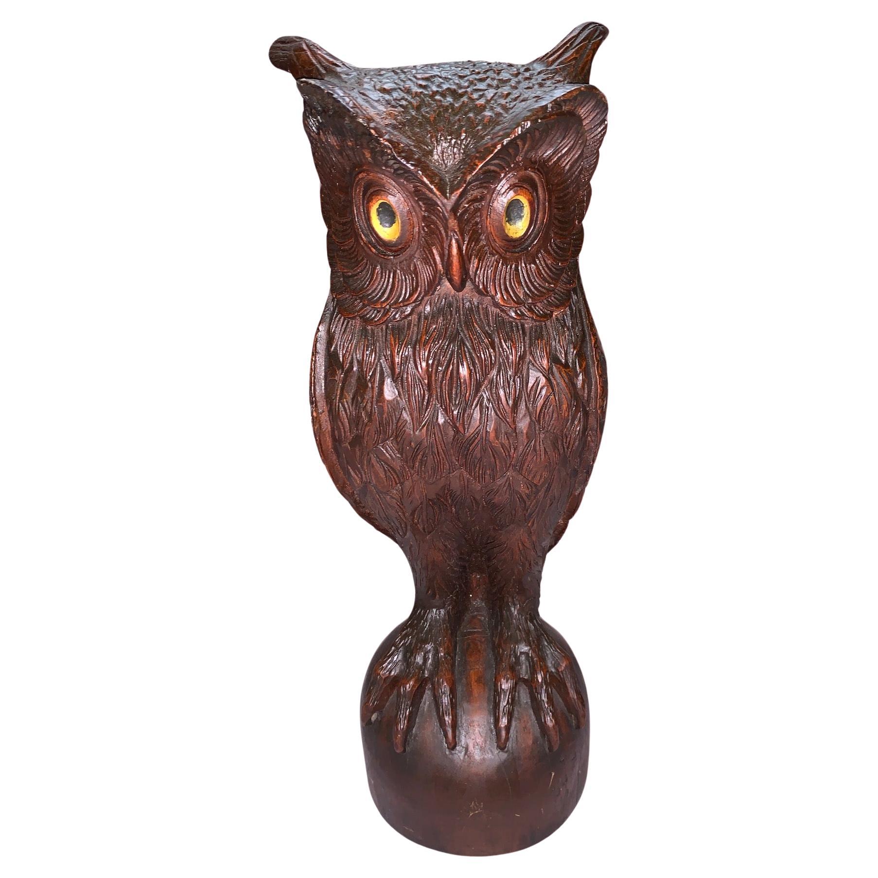 A Carved Wooden Owl Statue For Sale
