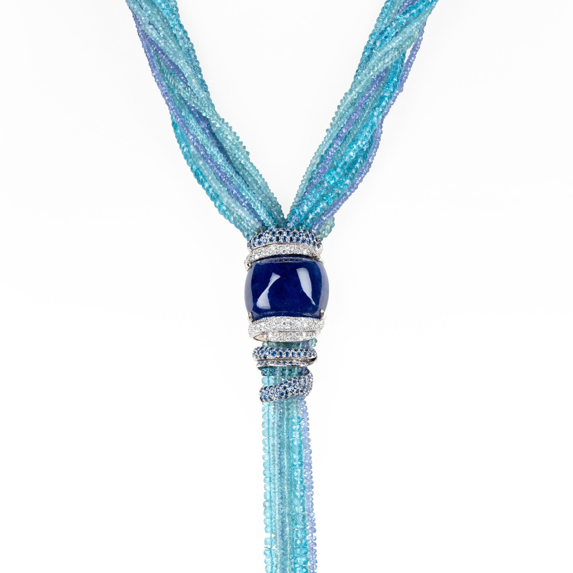 A d'Avossa Necklace from The Masterpiece Collection made in aquamarine, tanzanite and apatite wires 
A White Gold Ribbon with a pavé of Diamonds and Blu Sapphires hold a Central Cushion Cabochon Tanzanite of 150 cts

A Unique Piece

Ref. Number