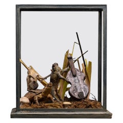 Used A cased taxidermy display of Toad and Frog orchestra playing stringed instrument