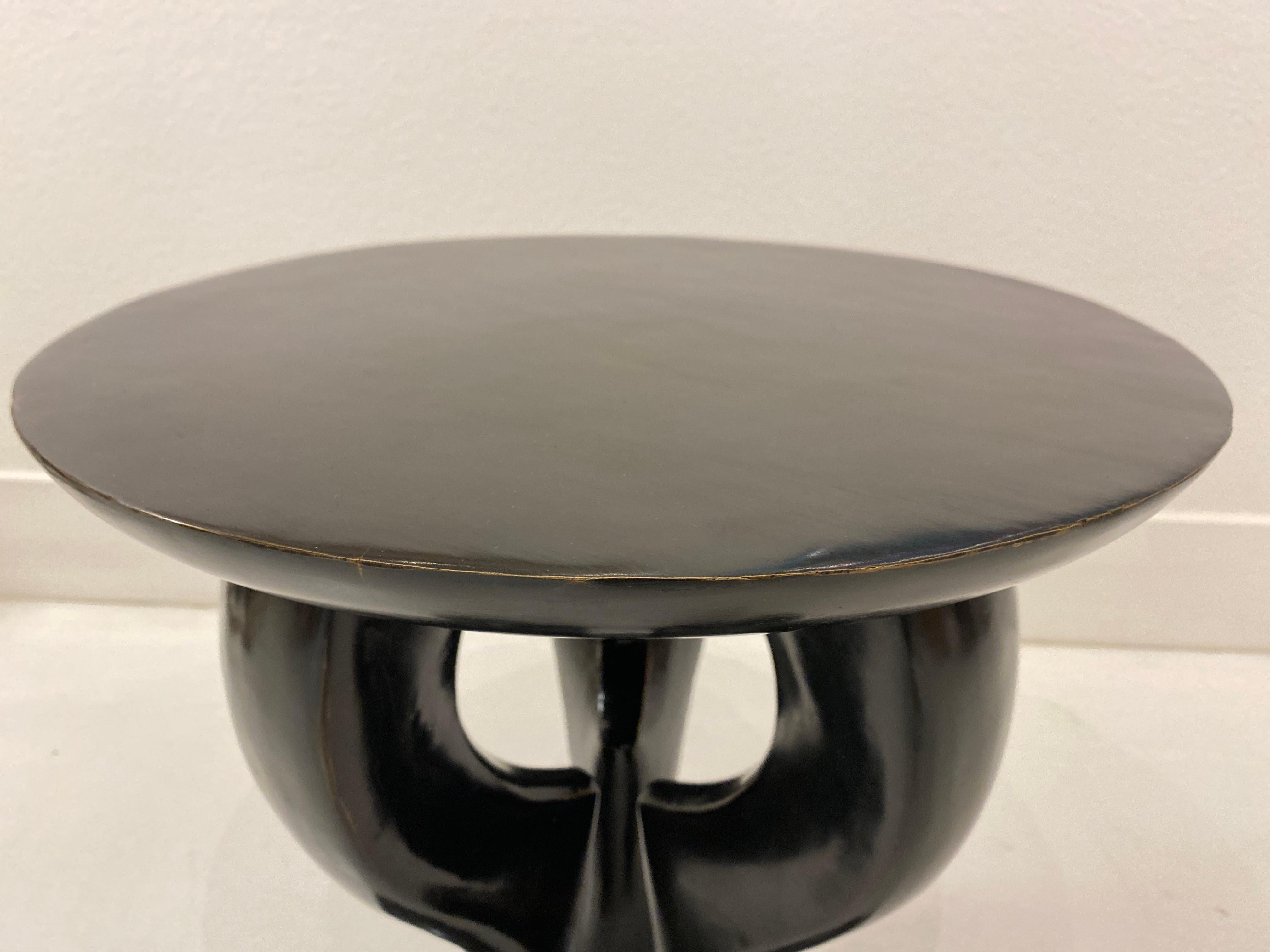 This is a striking rare bronze Le Lion Accent table by Jacques Garcia for Baker Furniture Co. Resin and black lacquer Le Lion's are easier to come by than this cast bronze example. The round top is surrounded by a curved apron and supported by 3
