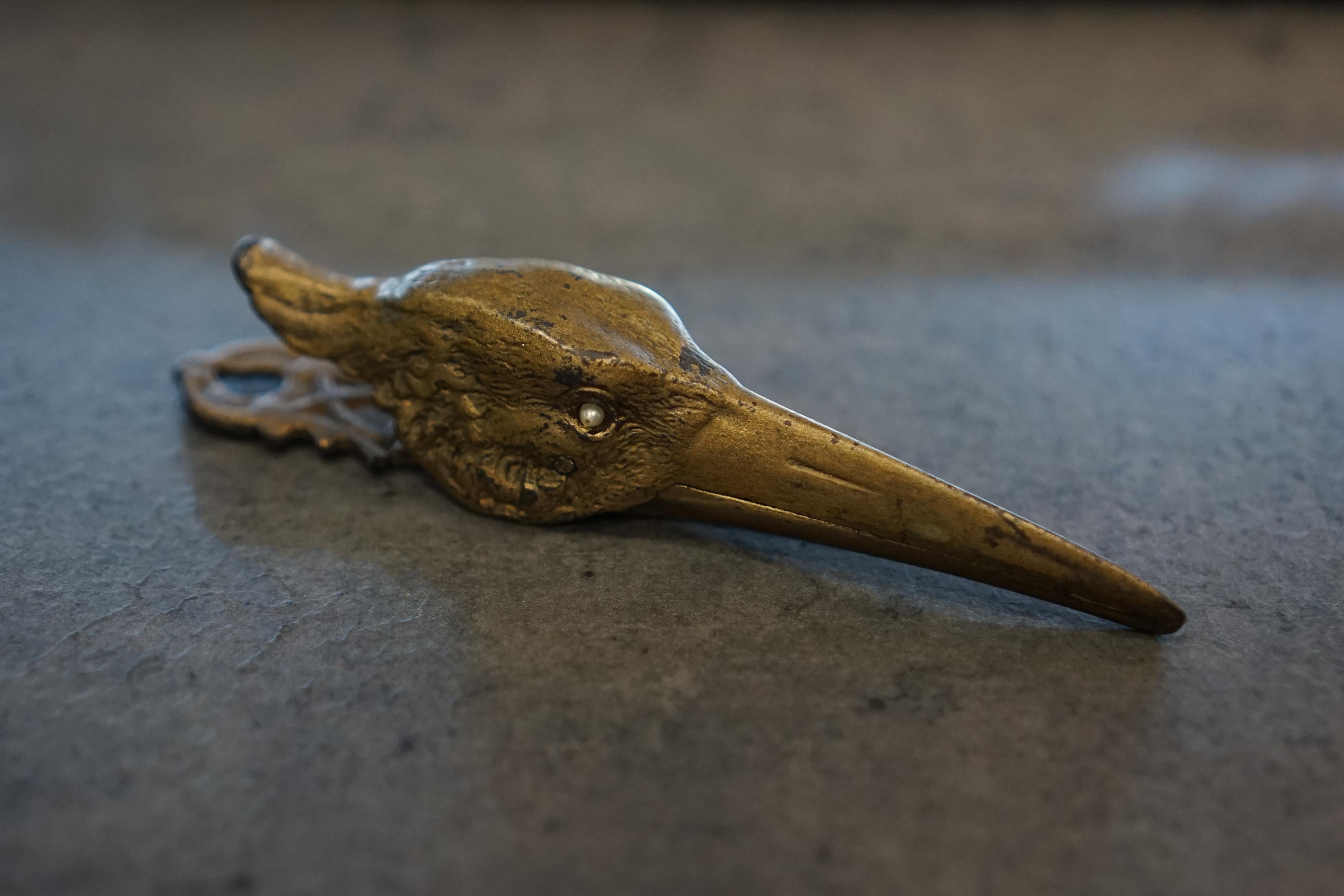 This exquisite cast bronze sprung hinged letter/document clip from France circa 1880 is a stunning example of functional artistry. Crafted in the form of a crane's head, it embodies the grace and elegance of the avian inspiration. The clip's design