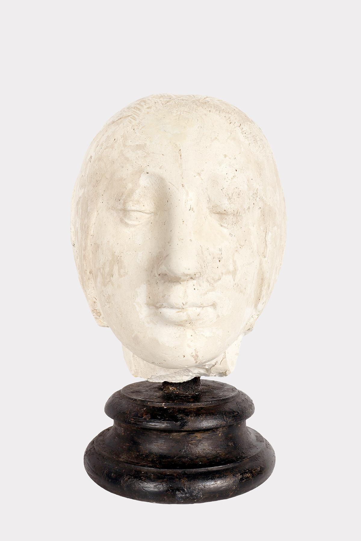 Over the wooden black painted base is set a cast of Eleonora D’Aragona head. Copy of the marble sculpture by Laurana. Cast for drawing teaching in Academy. Italy circa 1880.
