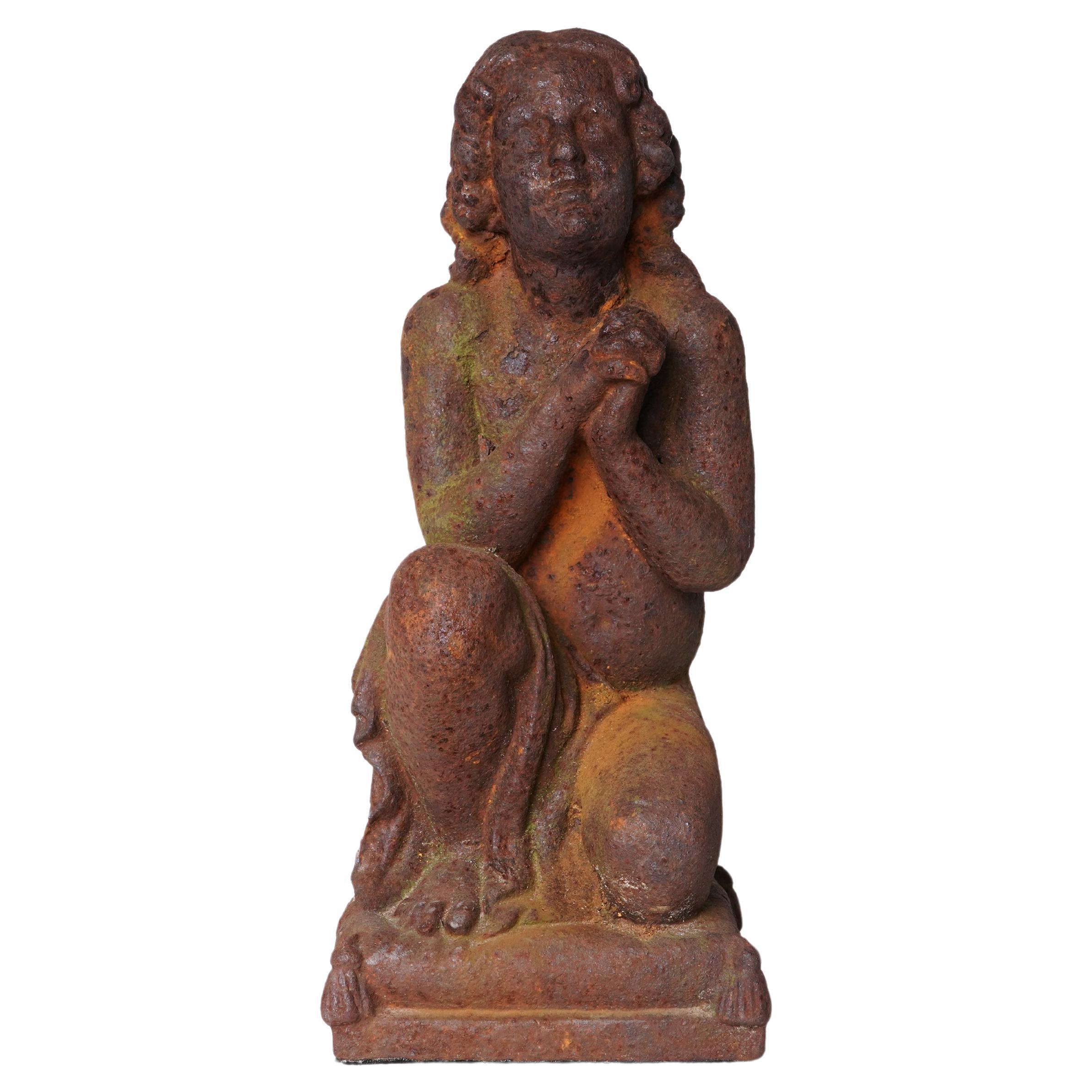 A Cast Iron Figure of a Young Boy For Sale