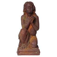 A Cast Iron Figure of a Young Boy