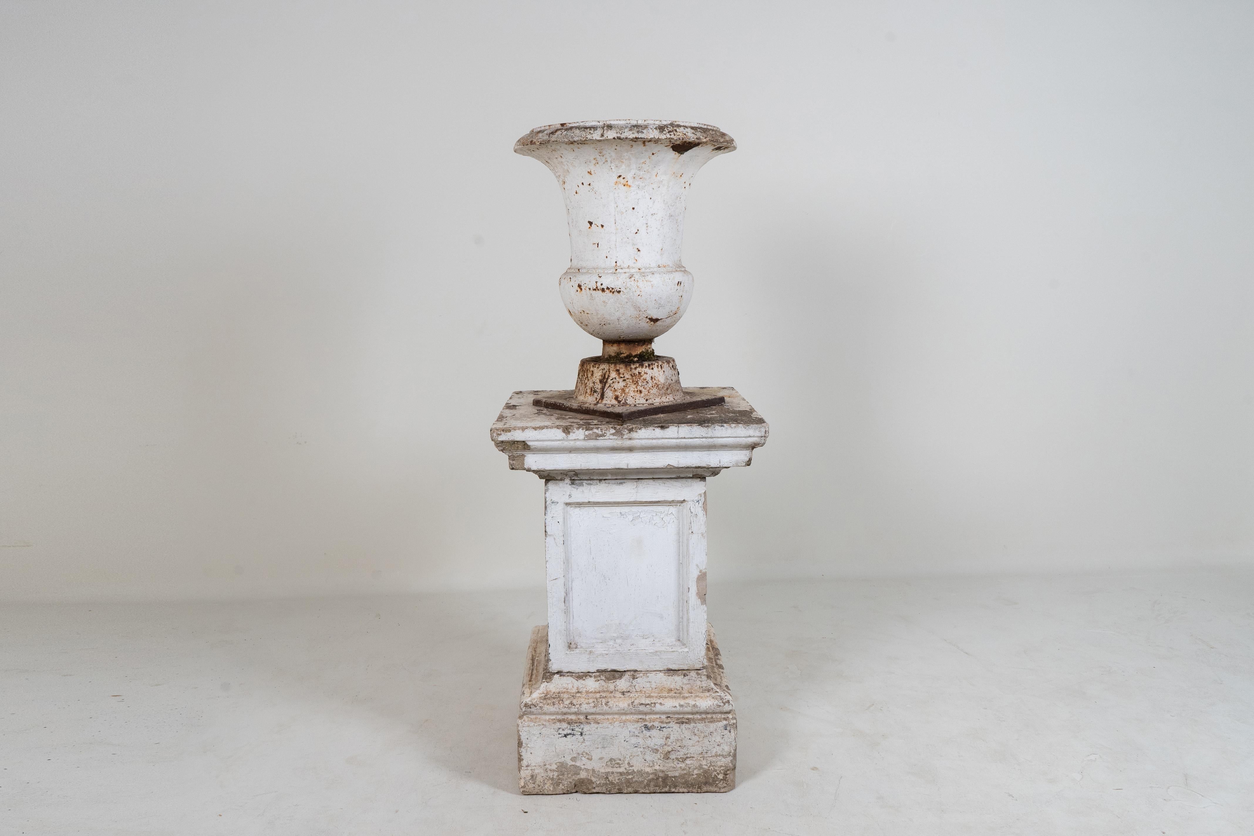 French A Cast Iron Urn with a Cement Base, France 20th. C For Sale