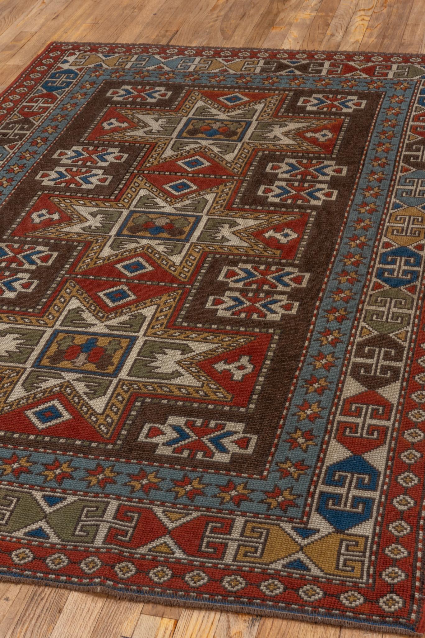 A Caucasian Rug circa 1940. Handknotted with 100% wool yarn.