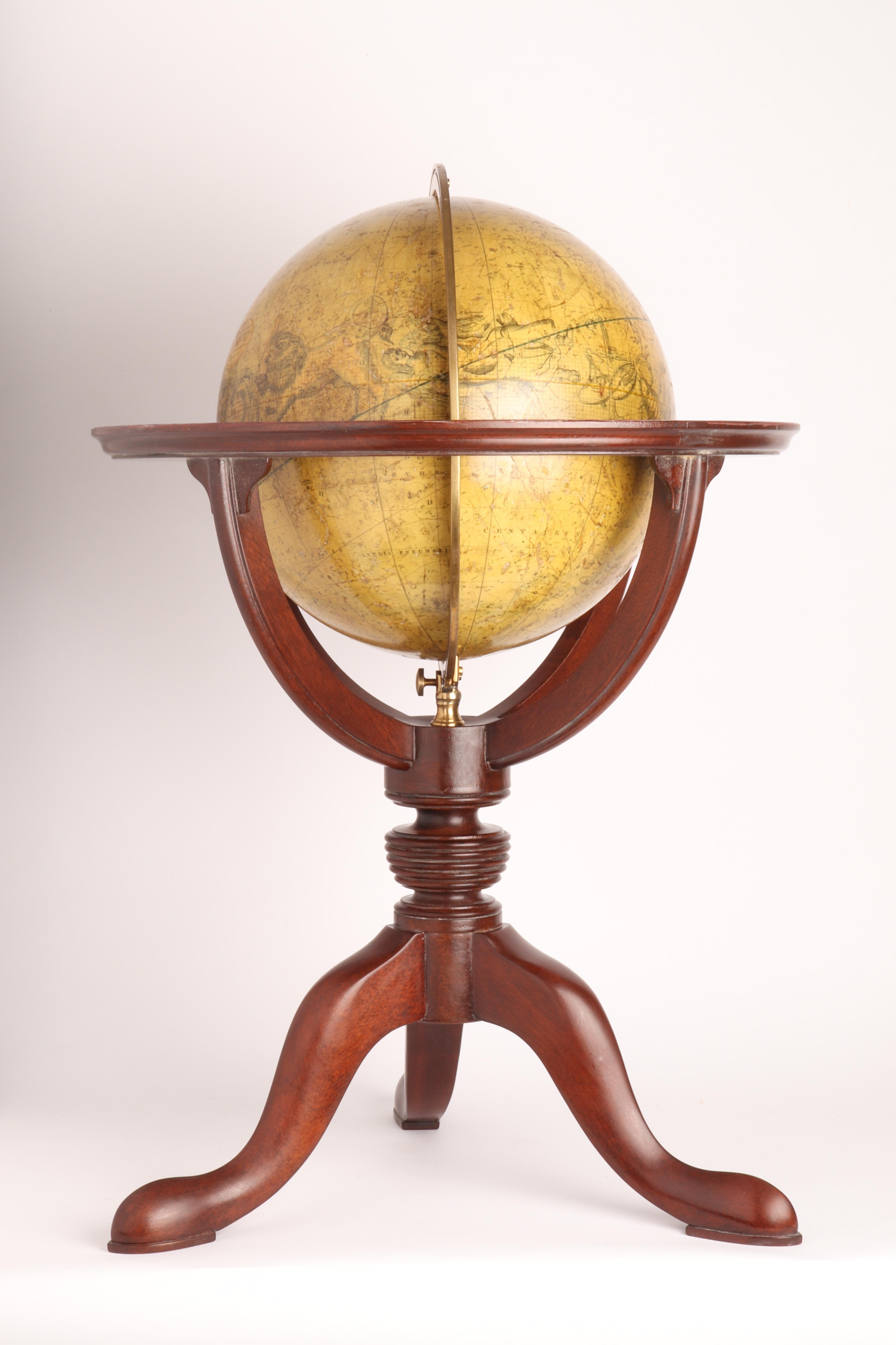 A celestial globe. Over a tripod-shaped foot that rises with a central element with moved profile, is connected to the brass meridian, which holds at the ends of the globe. The base is in mahogany wood. The globe is made out of paper-machè. Maker: